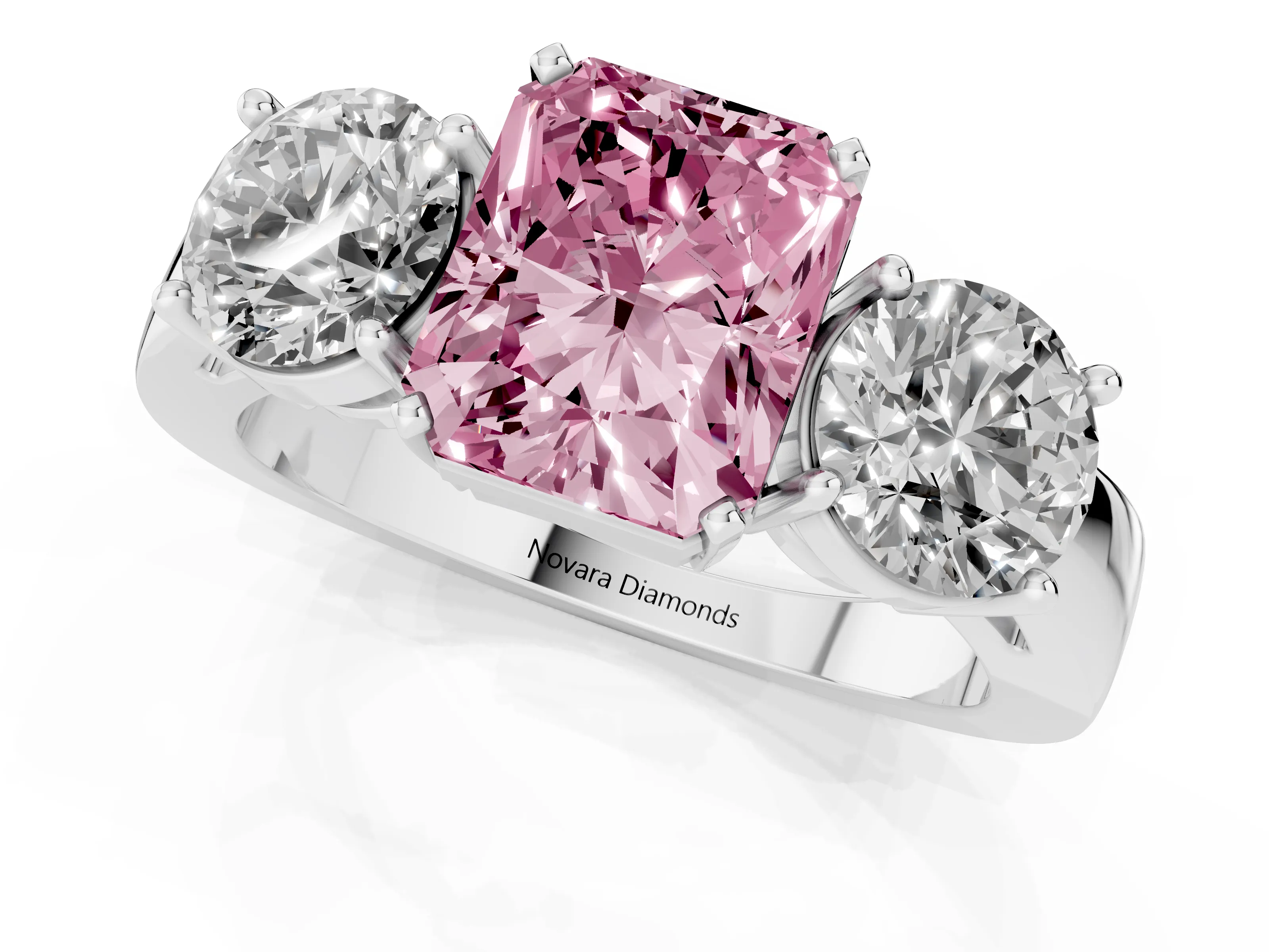 Fancy Pink Radiant Cut Diamond Three-Stone Ring Set in White gold with Round Side Stones and Classic Band