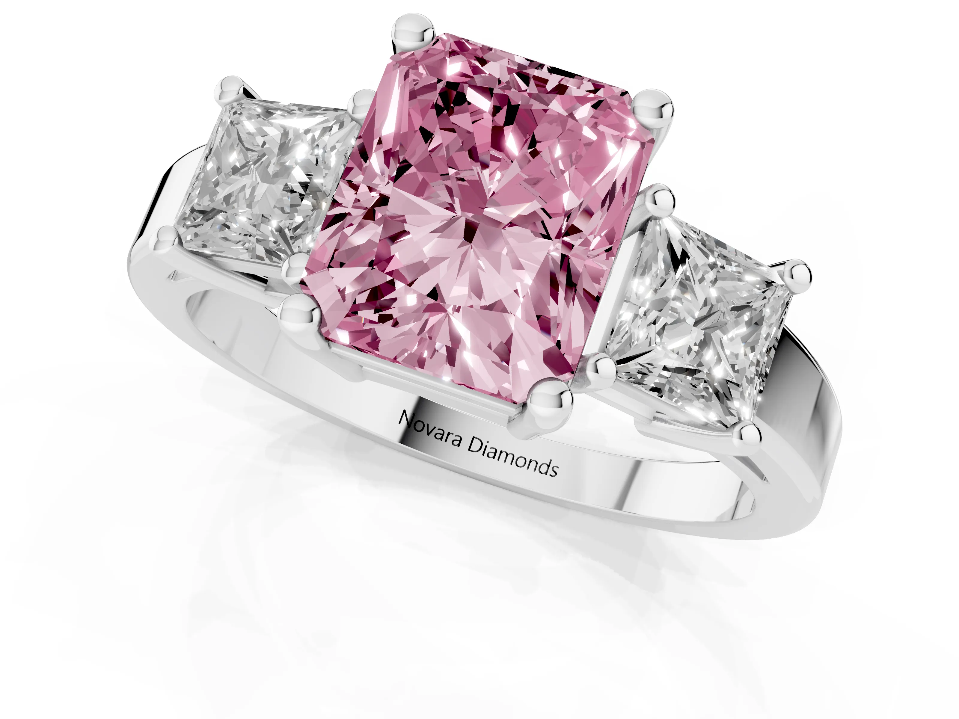 Fancy Pink Three-Stone Radiant Cut Diamond Solitaire Ring Set in Platinum with Prong Setting