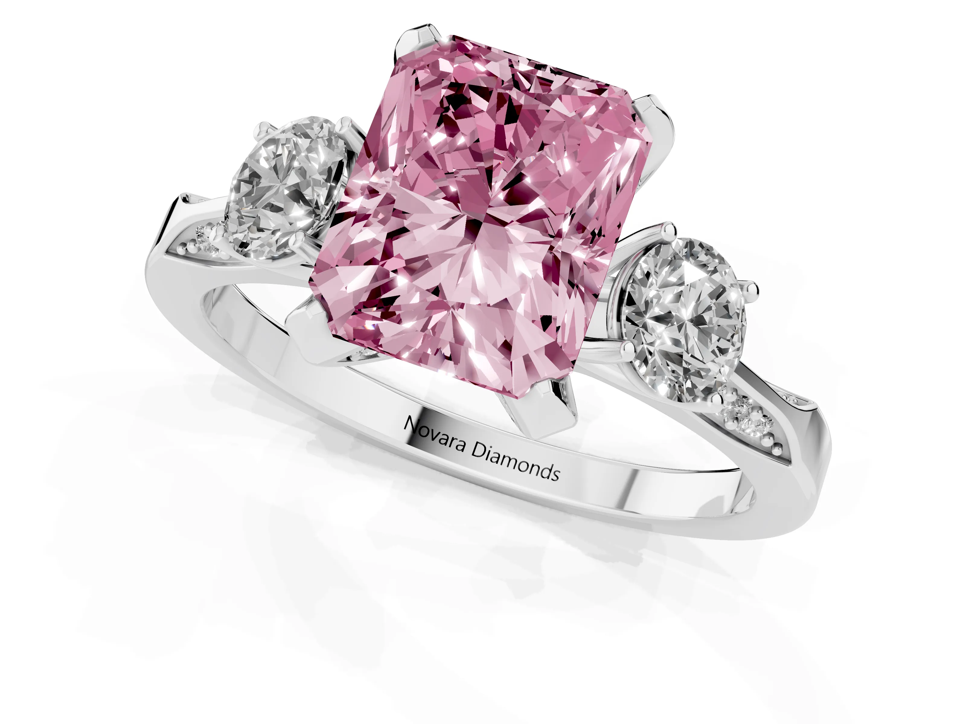 Fancy Pink Radiant Cut Diamond Three-Stone Ring Set in White gold with Pavé Band and Smaller Side Stones