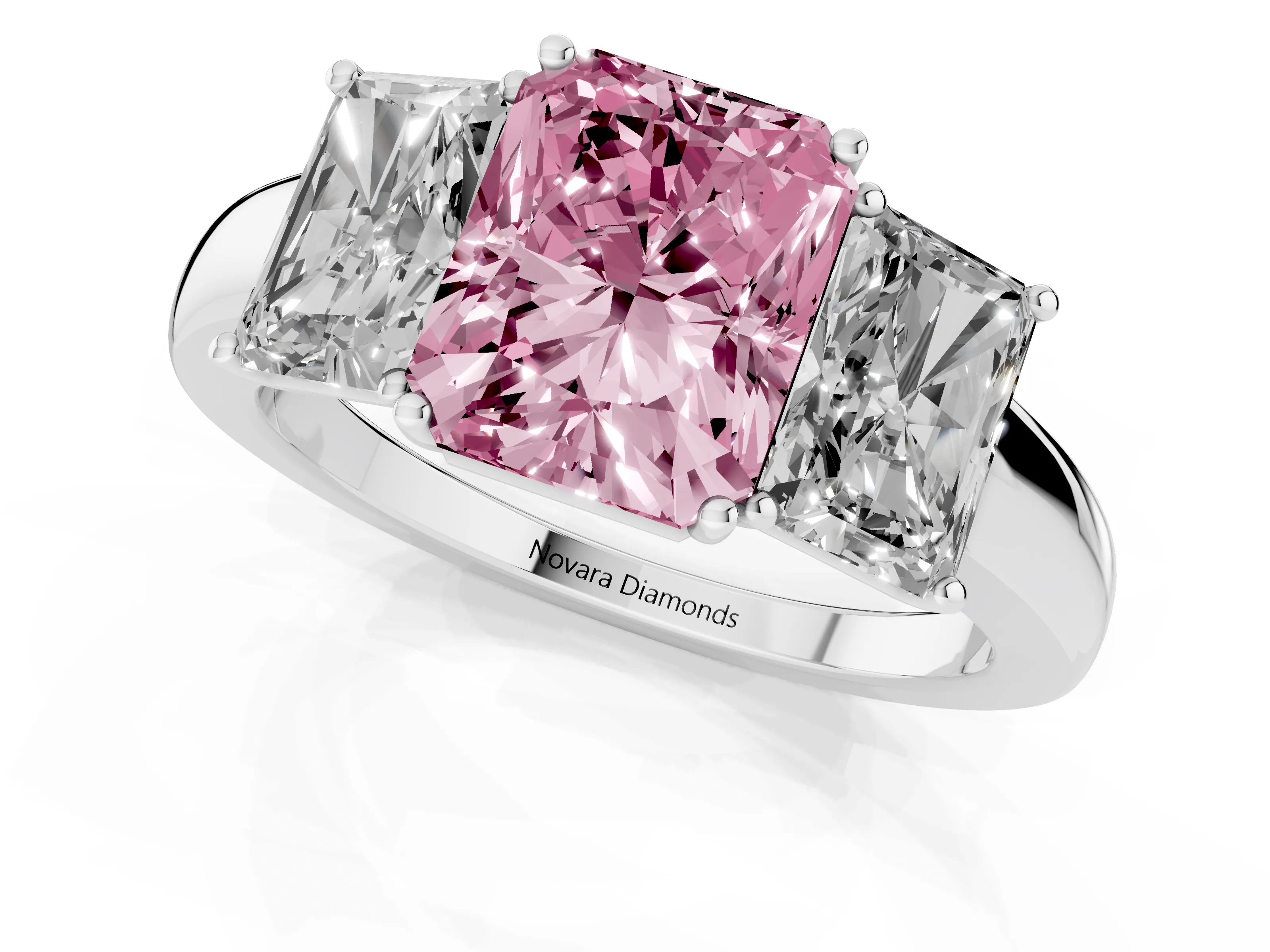 Fancy Pink Radiant Cut Diamond Three-Stone Ring Set in Platinum with Bold Center and Classic Band