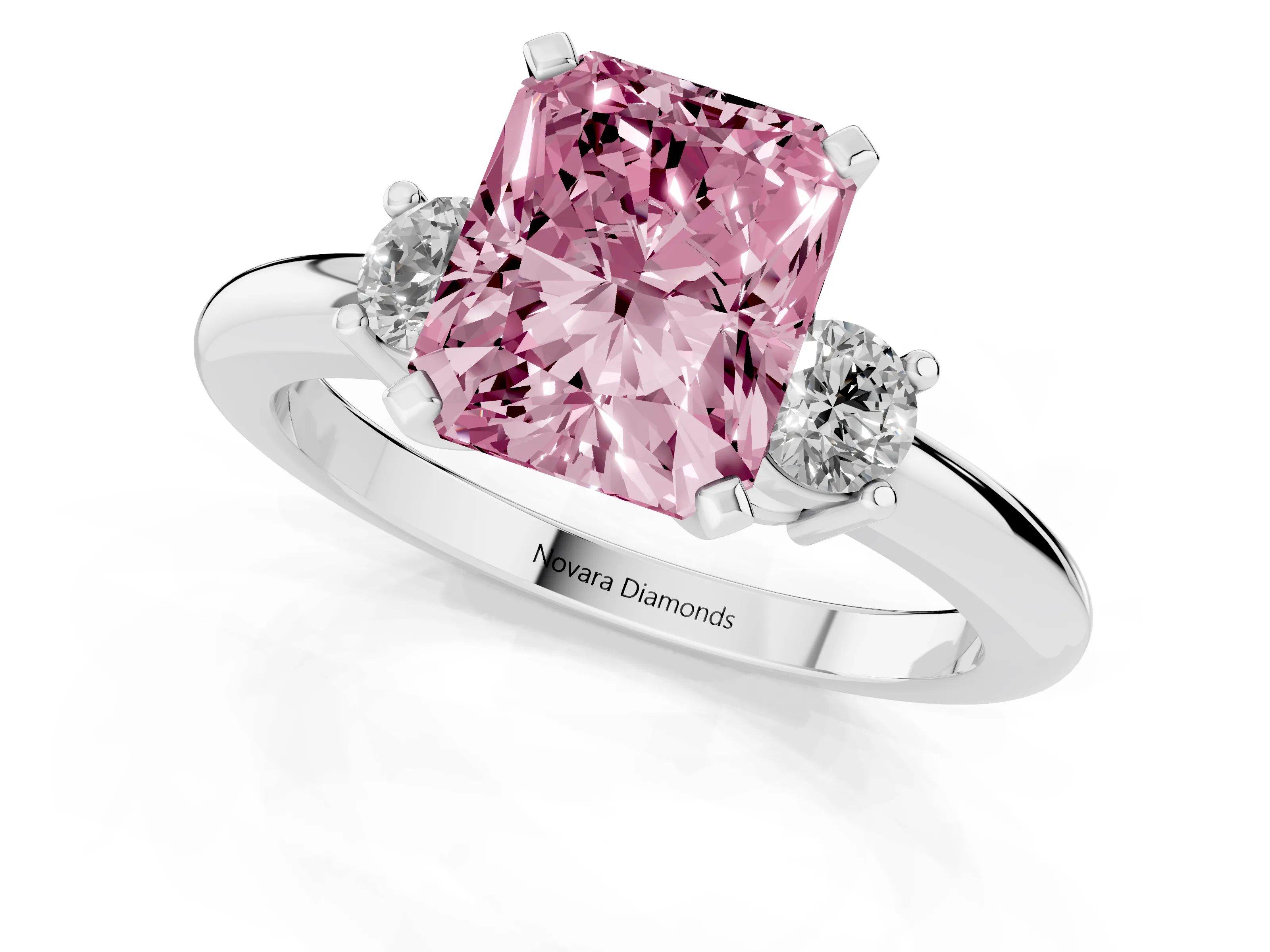 Fancy Pink Three-Stone Radiant Cut Diamond Ring Set in Platinum with Prong Setting and Plain Band