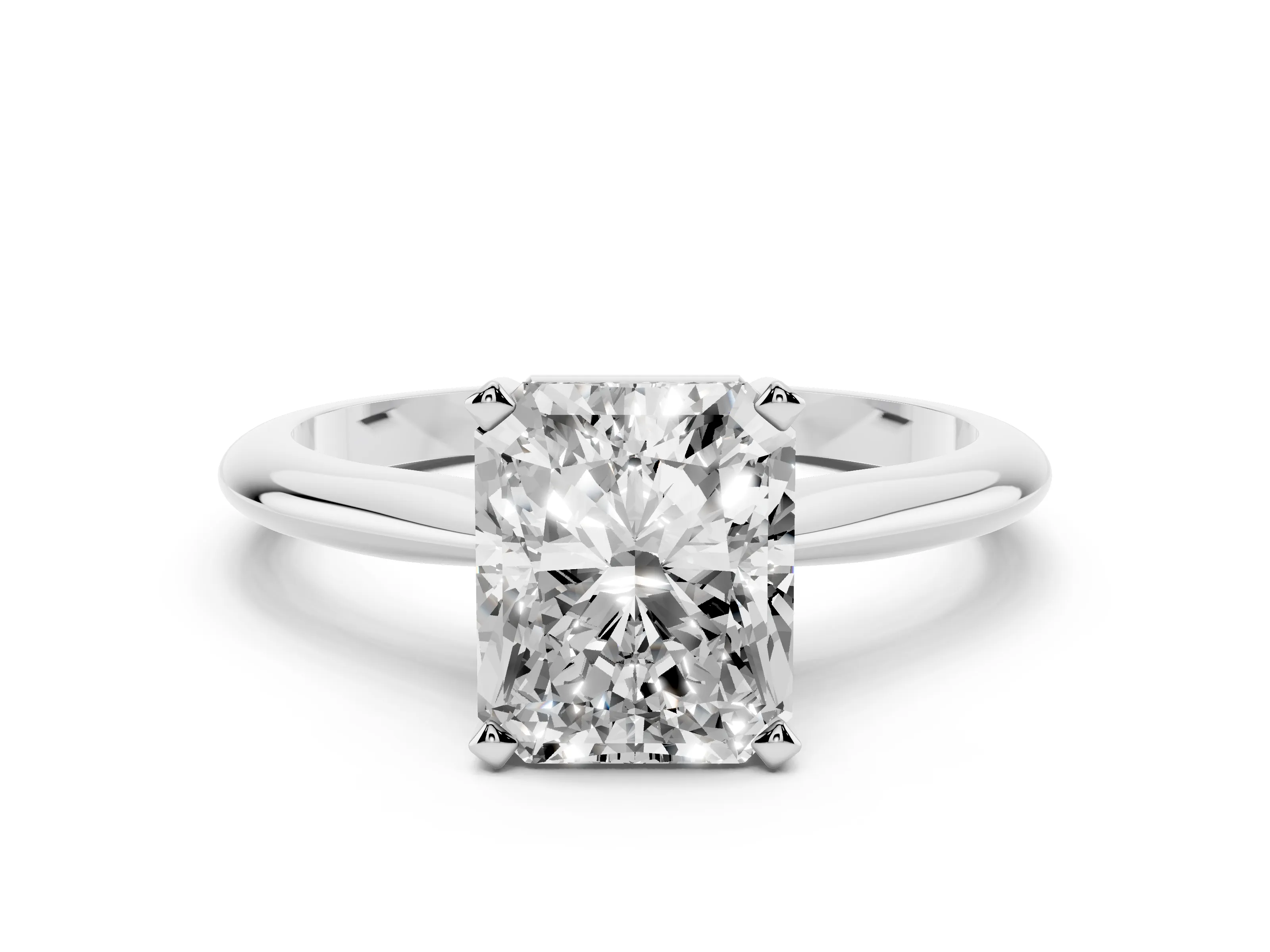 Radiant Cut Diamond Solitaire Ring Set in White gold with Prong Setting on a Plain Round Band