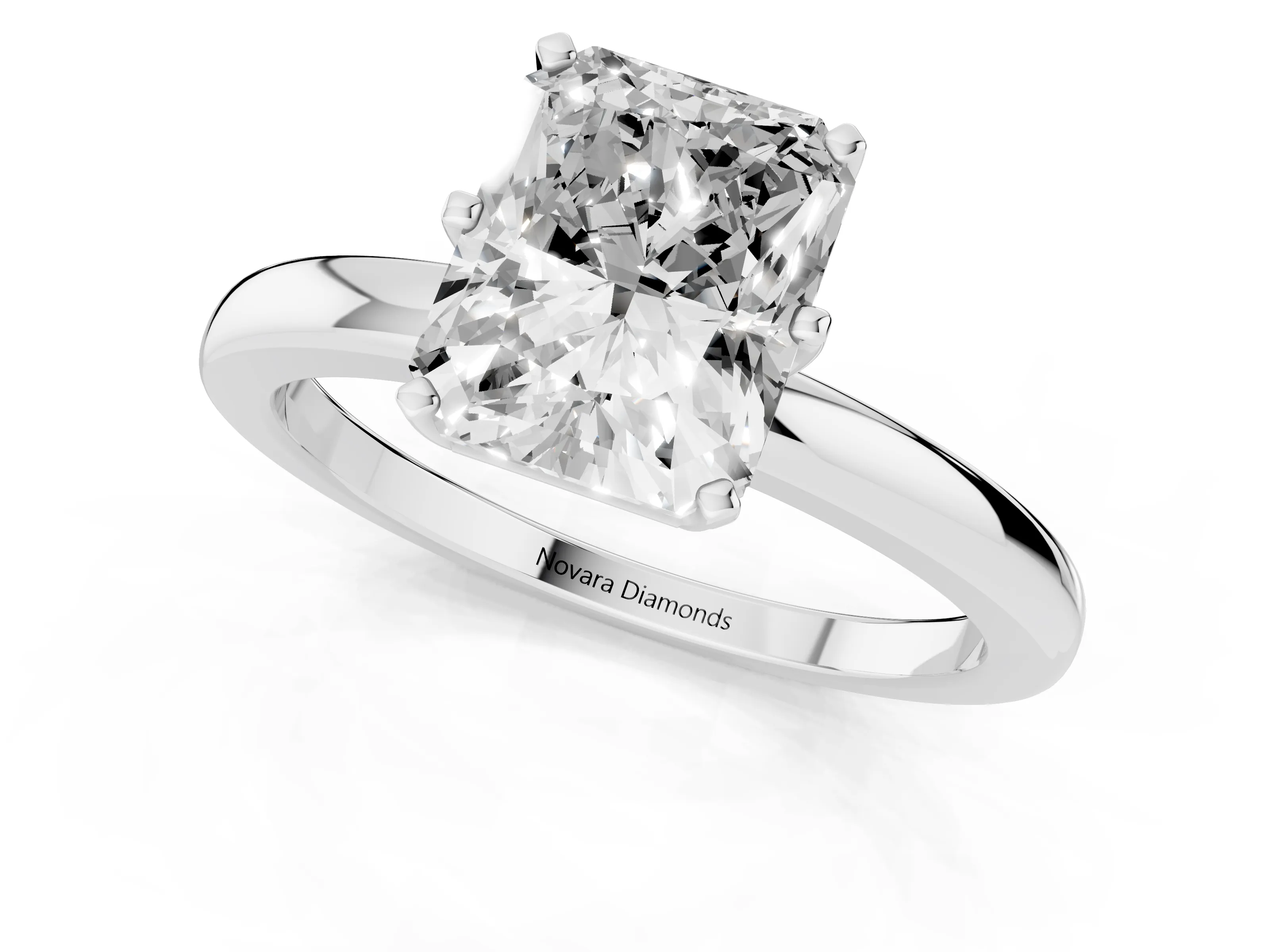 Radiant Cut Diamond Solitaire Ring Set in Silver with Raised Prong Setting on a Classic Band