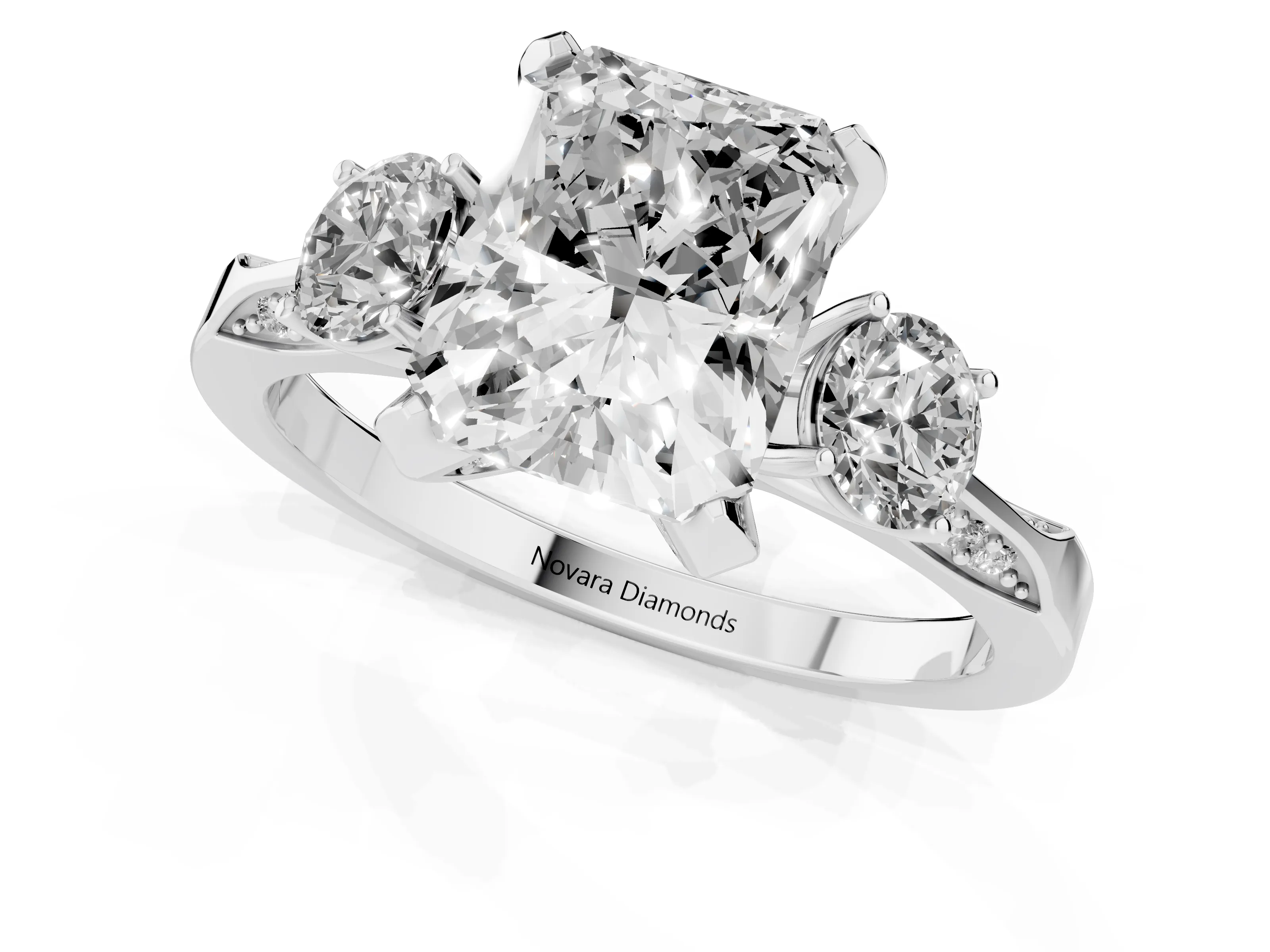 Radiant Cut Diamond Three-Stone Ring Set in Platinum with Pavé Band and Smaller Side Stones