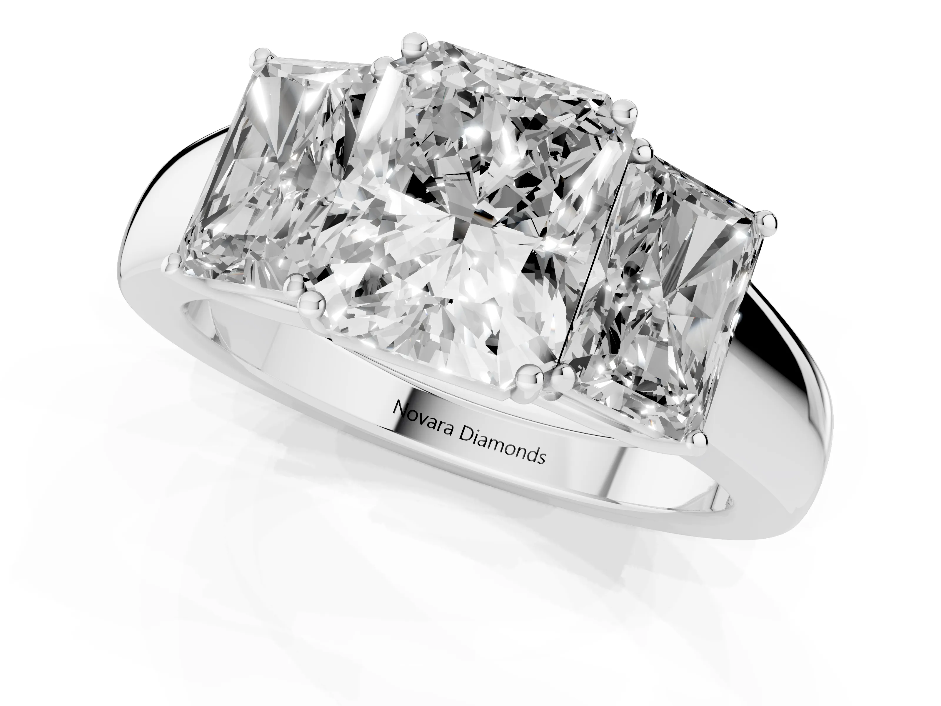 Three-Stone Radiant Cut Diamond Ring Set in White gold with Matching Prong Settings and Plain Band