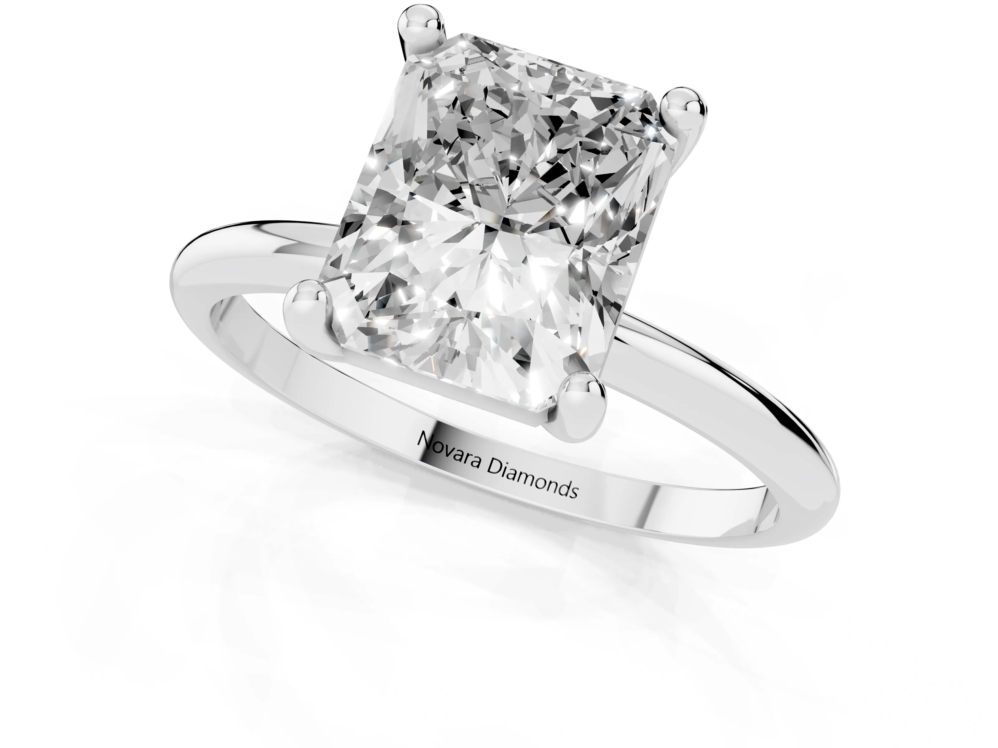 Radiant Cut Diamond Solitaire Ring Set in White gold with Secure Prong Setting on a Classic Band