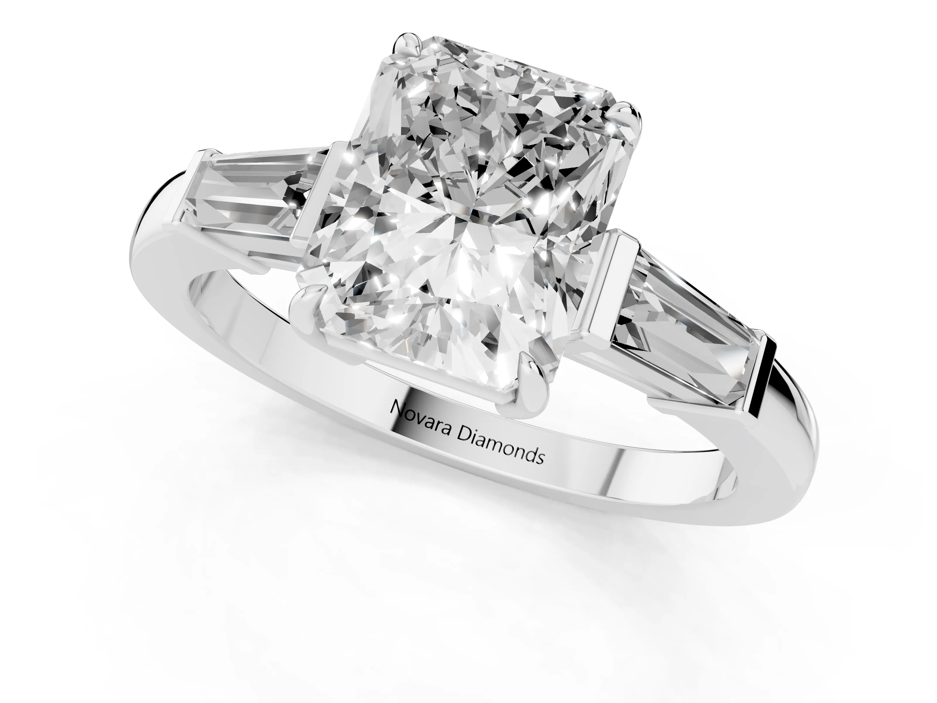 Radiant Cut Diamond Three-Stone Ring Set in White gold with Tapered Baguette Side Stones and Prong Setting