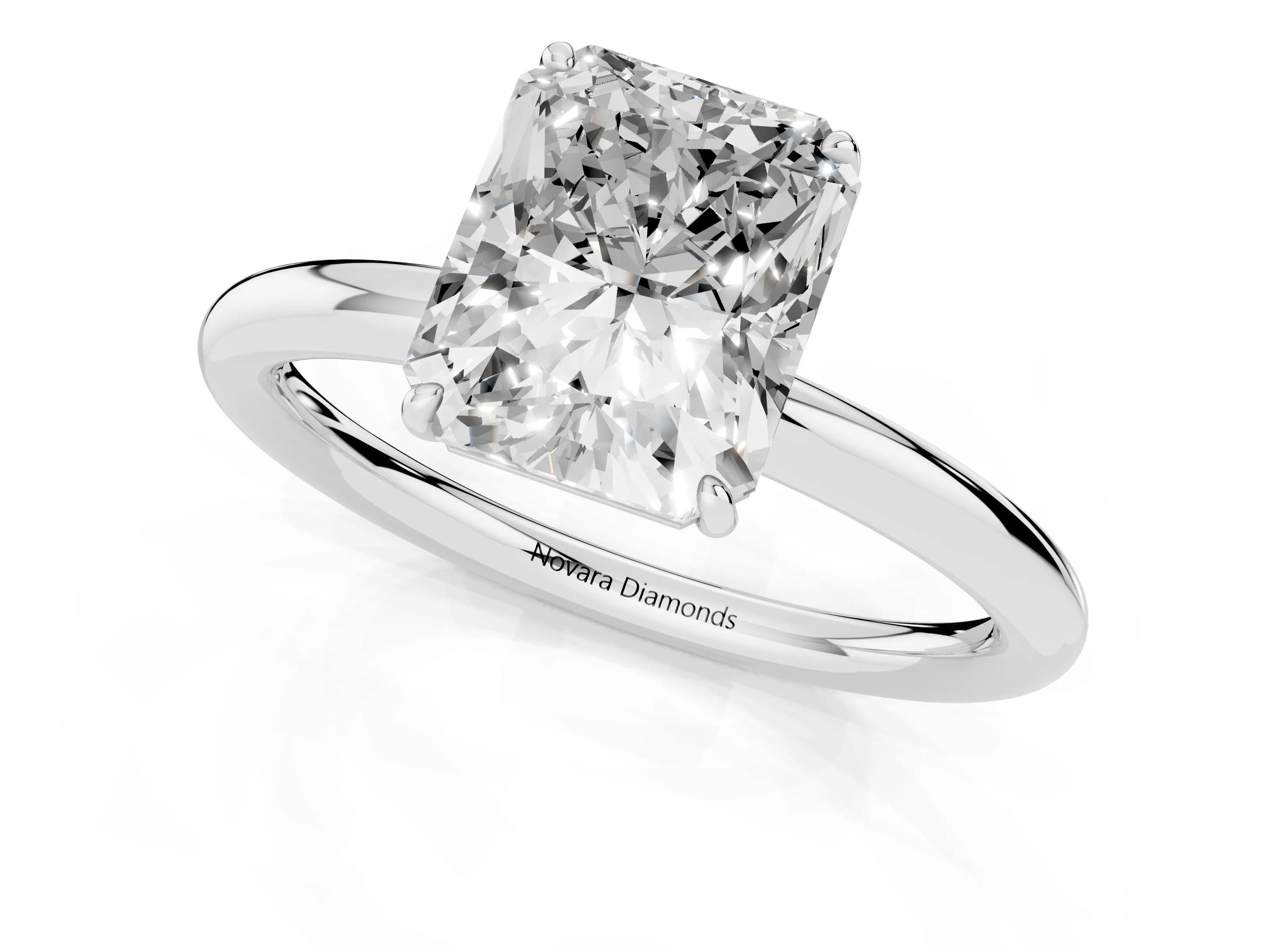 Radiant Cut Diamond Solitaire Ring Set in Silver with Prong Setting on a Polished Plain Band