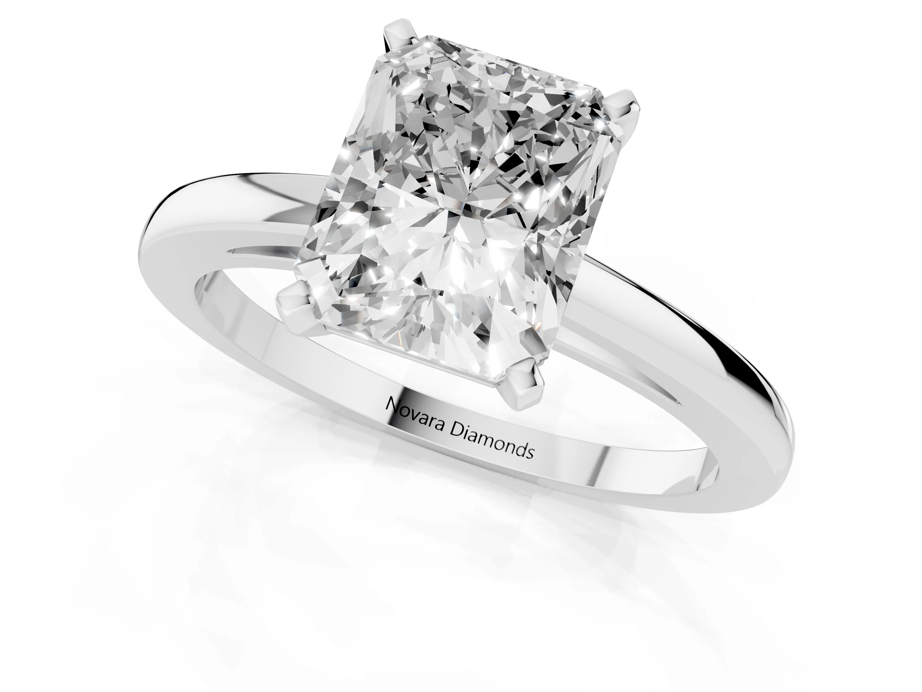 Radiant Cut Diamond Solitaire Engagement Ring Set in White gold with Prong Setting on a Classic Band