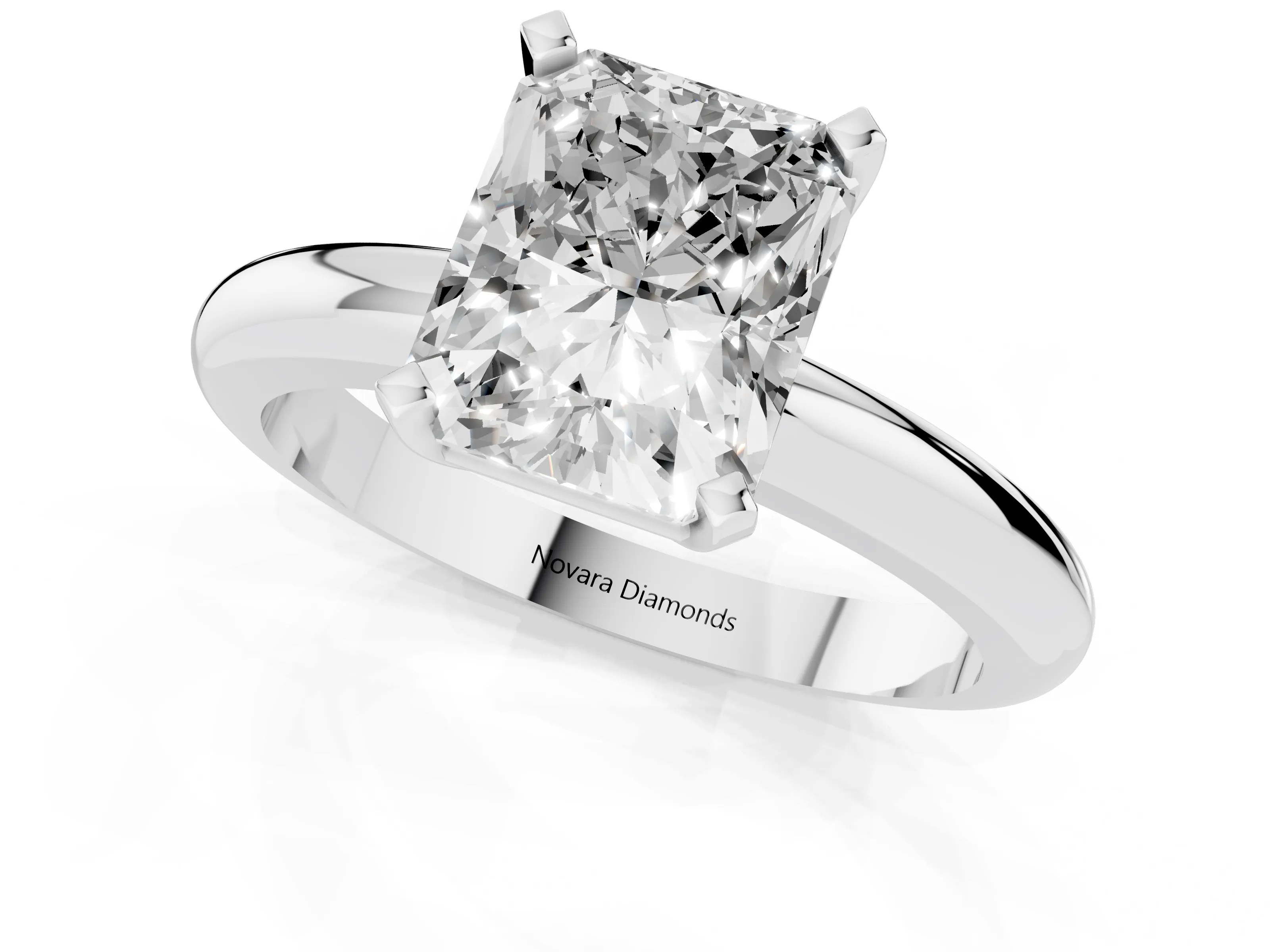 Radiant Cut Diamond Solitaire Engagement Ring Set in Platinum with Round Band and Prong Setting