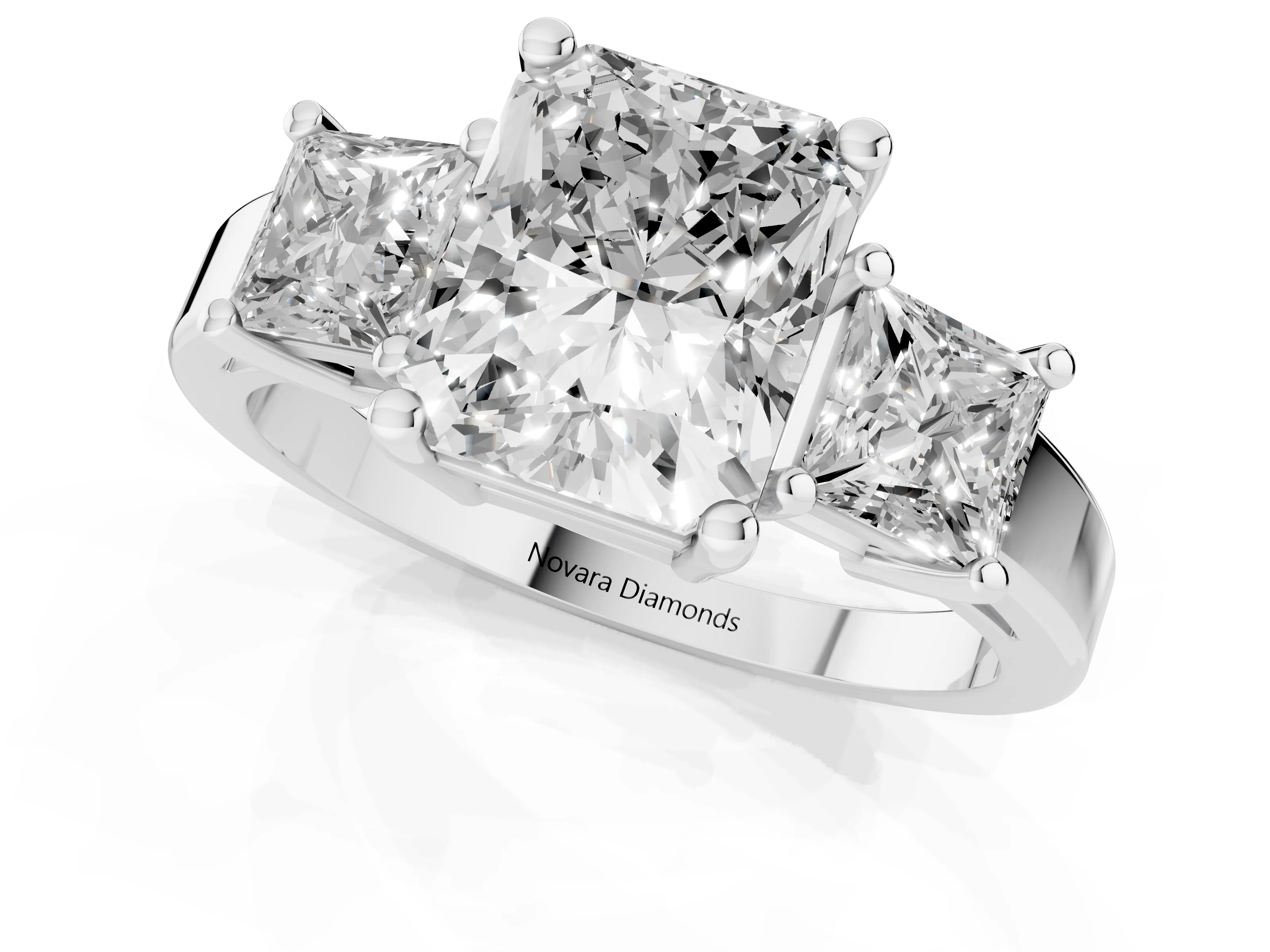 Three-Stone Radiant Cut Diamond Solitaire Ring Set in Platinum with Prong Setting