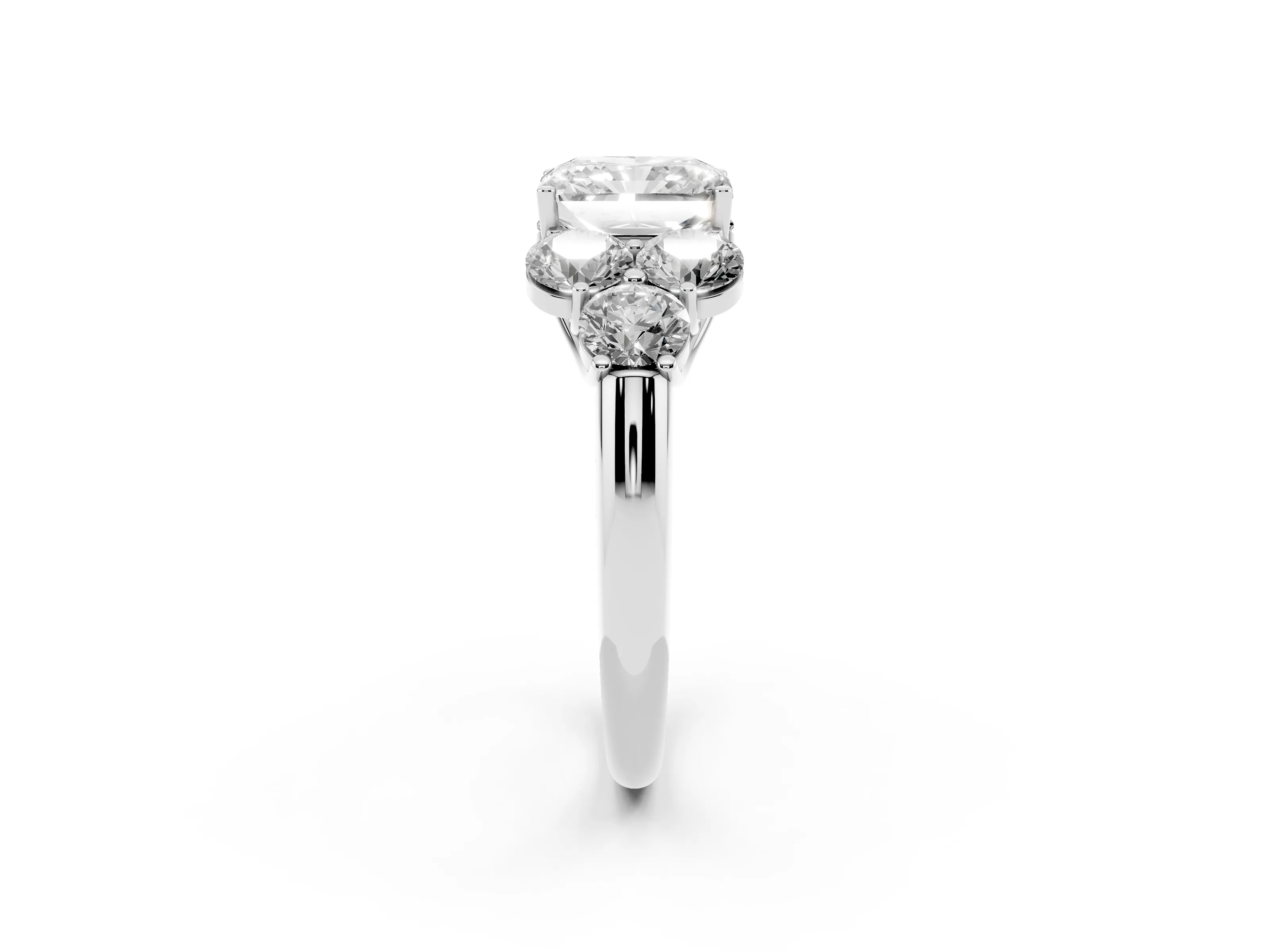 Radiant Cut Diamond Cluster Ring Set in Silver with Round Accent Stones and Prong Setting on a Plain Band