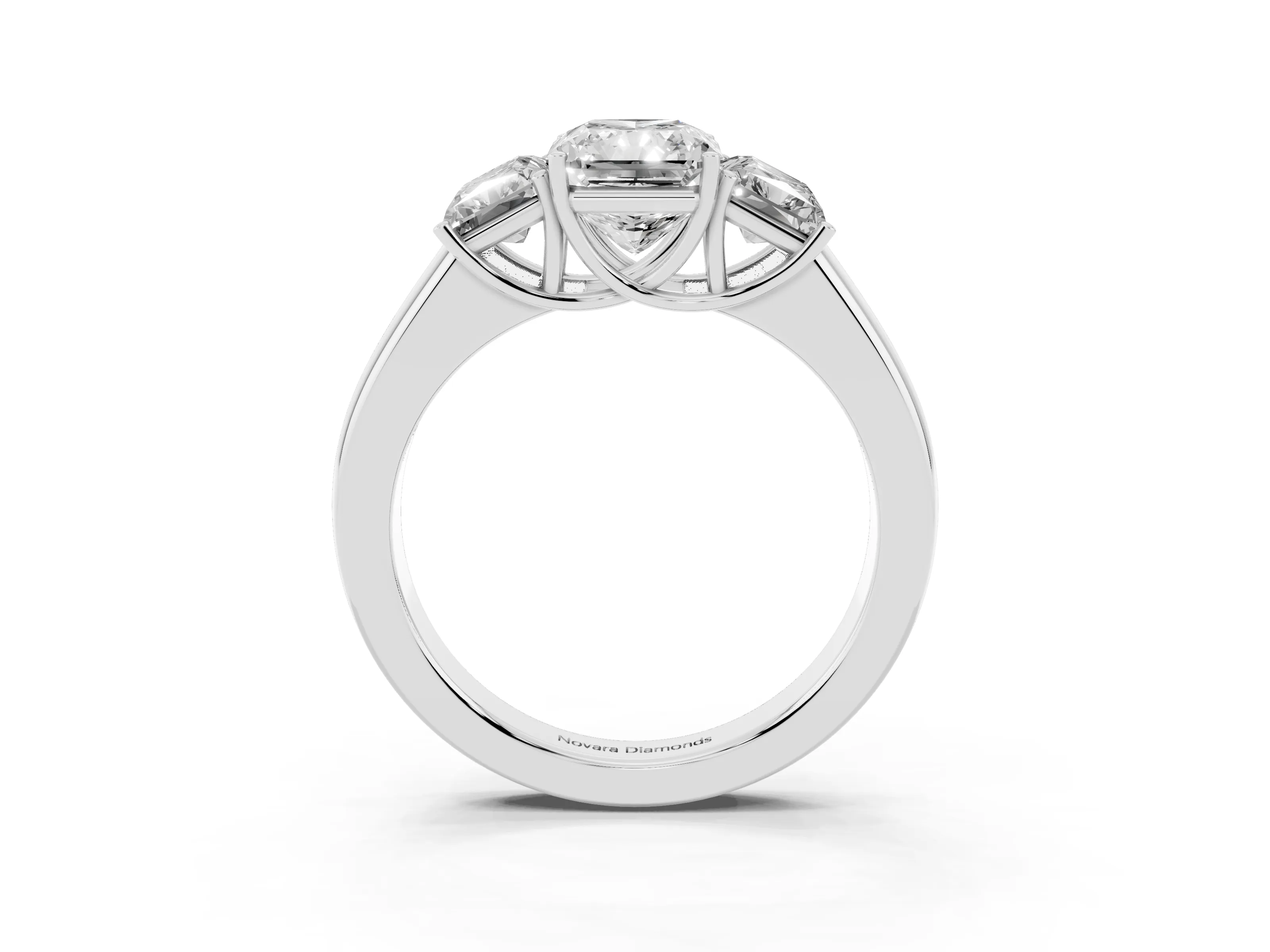 Three-Stone Radiant Cut Diamond Ring Set in White gold with Matching Prong Settings and Plain Band