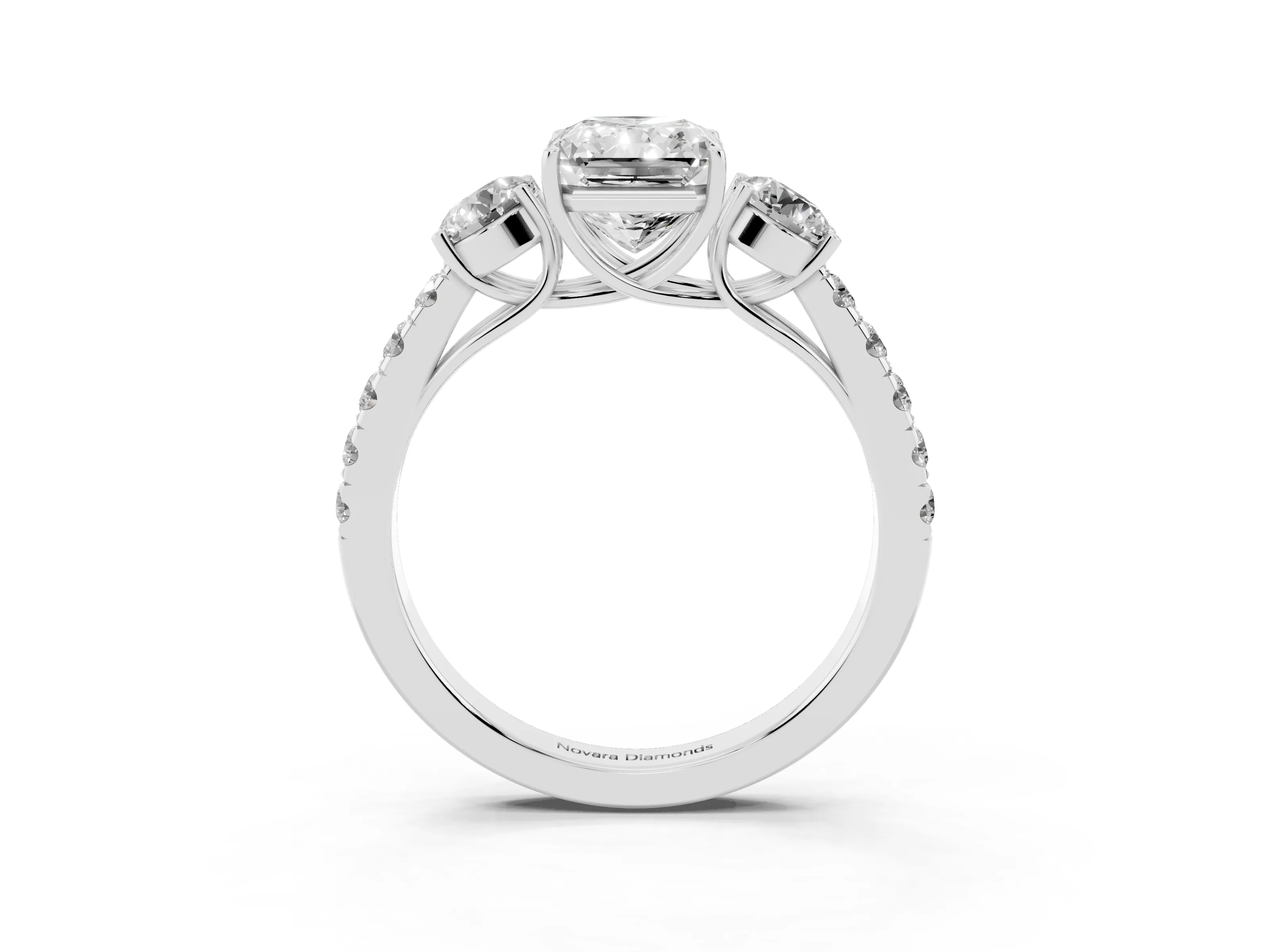 Radiant Cut Diamond Three-Stone Ring Set in Platinum with Round Side Stones and Delicate Pavé Band