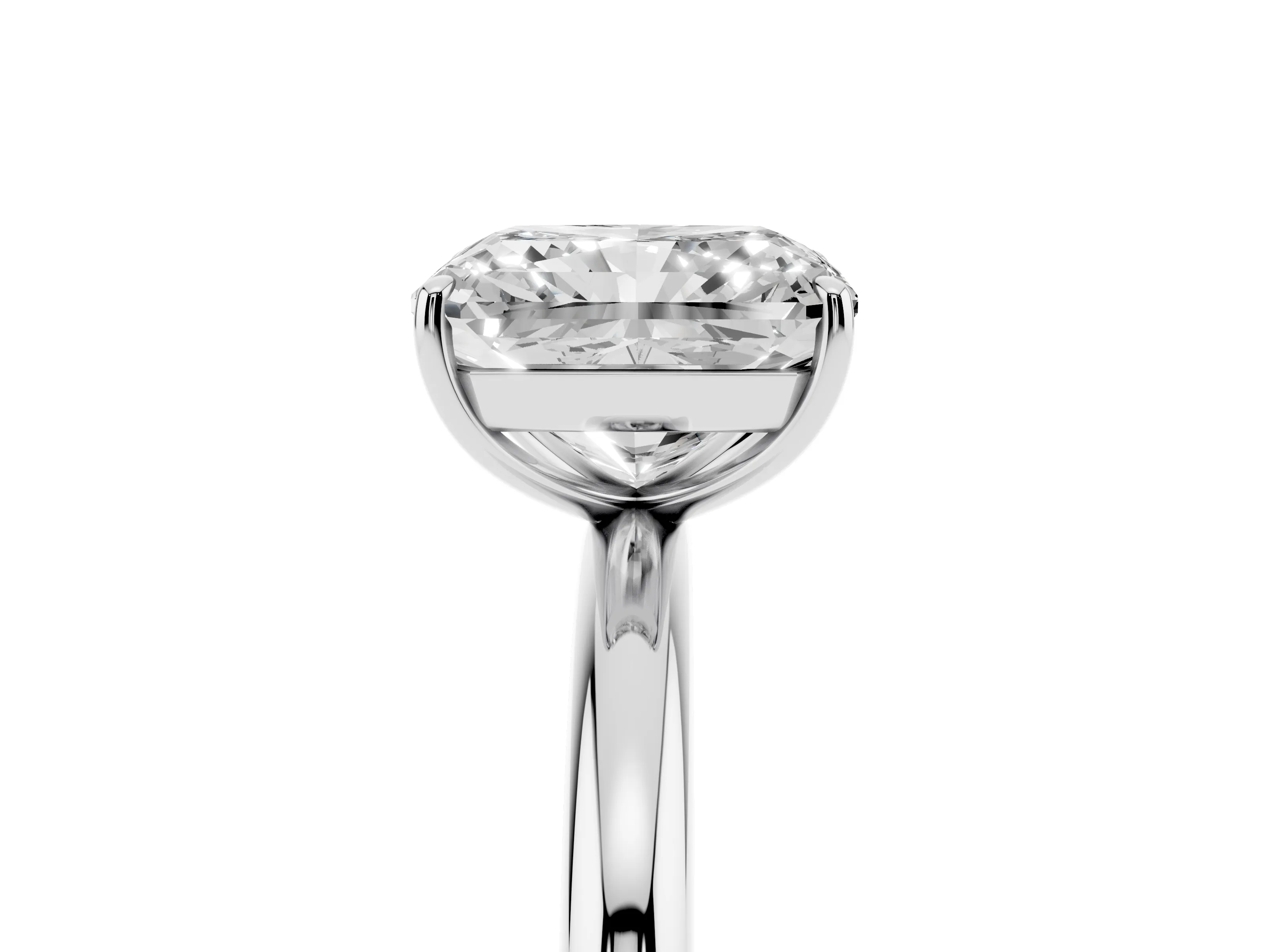 Radiant Cut Diamond Solitaire Ring Set in Silver with Prong Setting on a Polished Plain Band