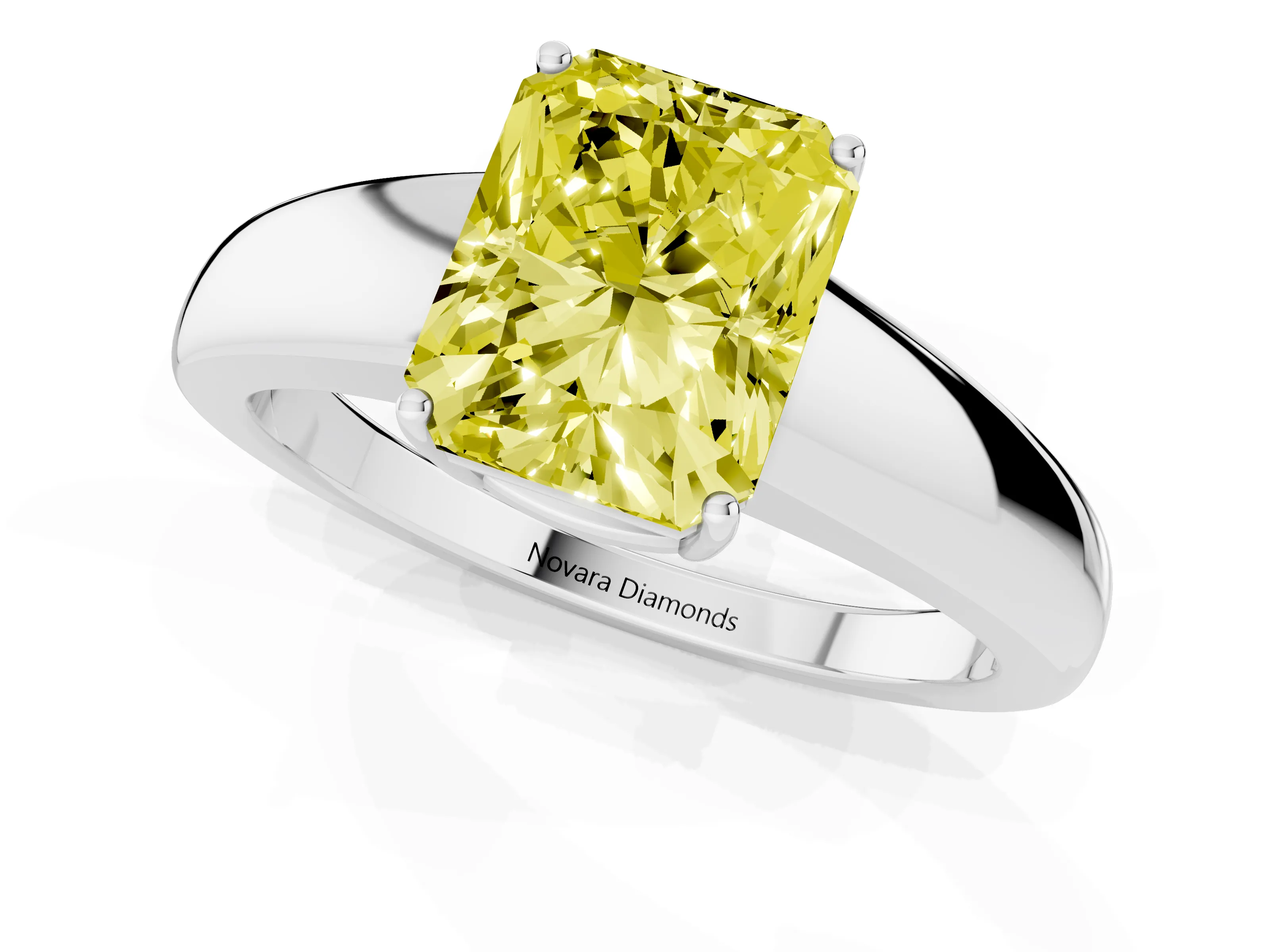 Fancy Yellow Radiant Cut Diamond Solitaire Ring Set in White gold with Tapered Band and Prong Setting