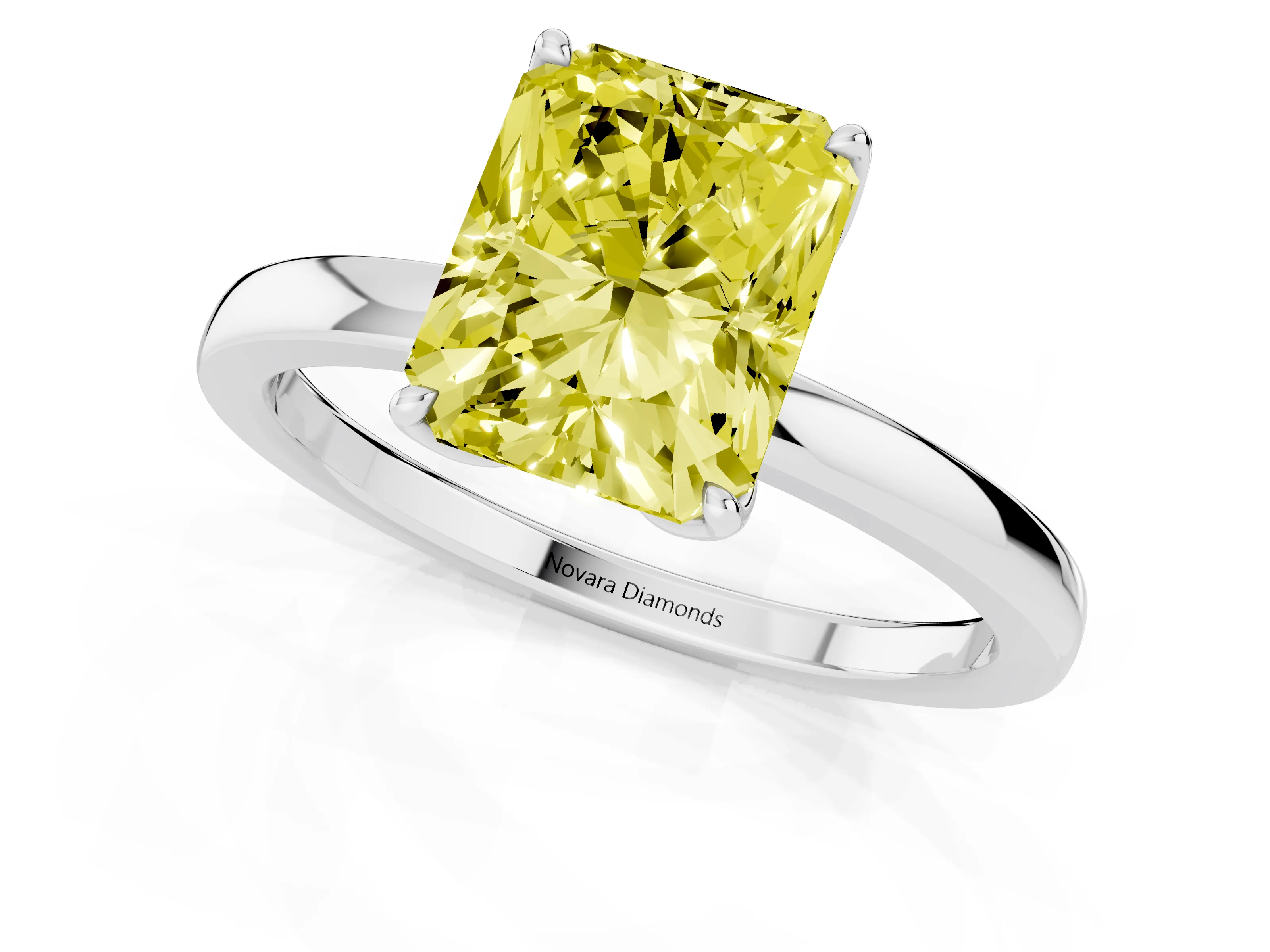 Fancy Yellow Radiant Cut Diamond Solitaire Ring Set in White gold with Prong Setting and Thin Polished Band