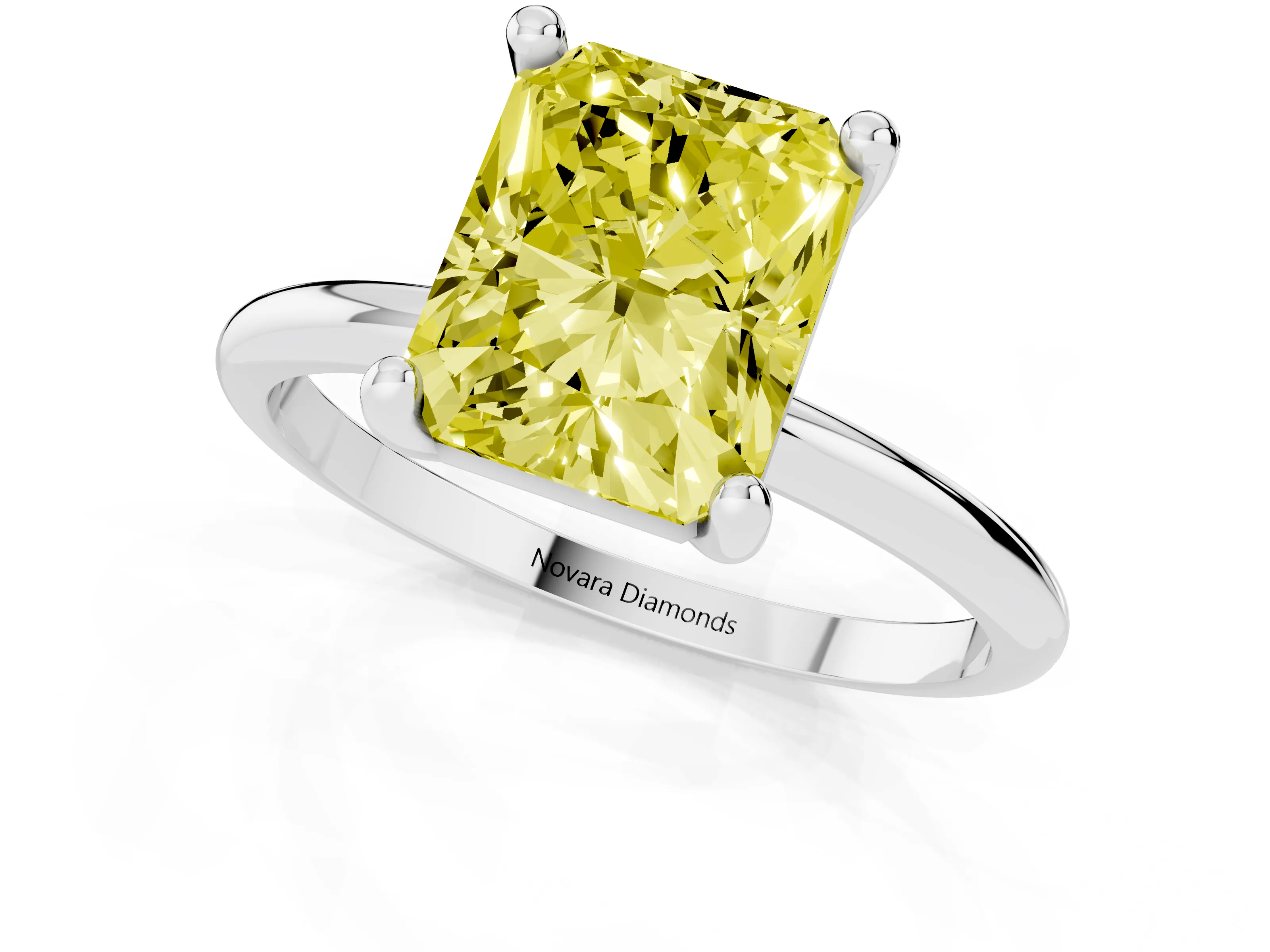 Fancy Yellow Radiant Cut Diamond Solitaire Ring Set in White gold with Secure Prong Setting on a Classic Band