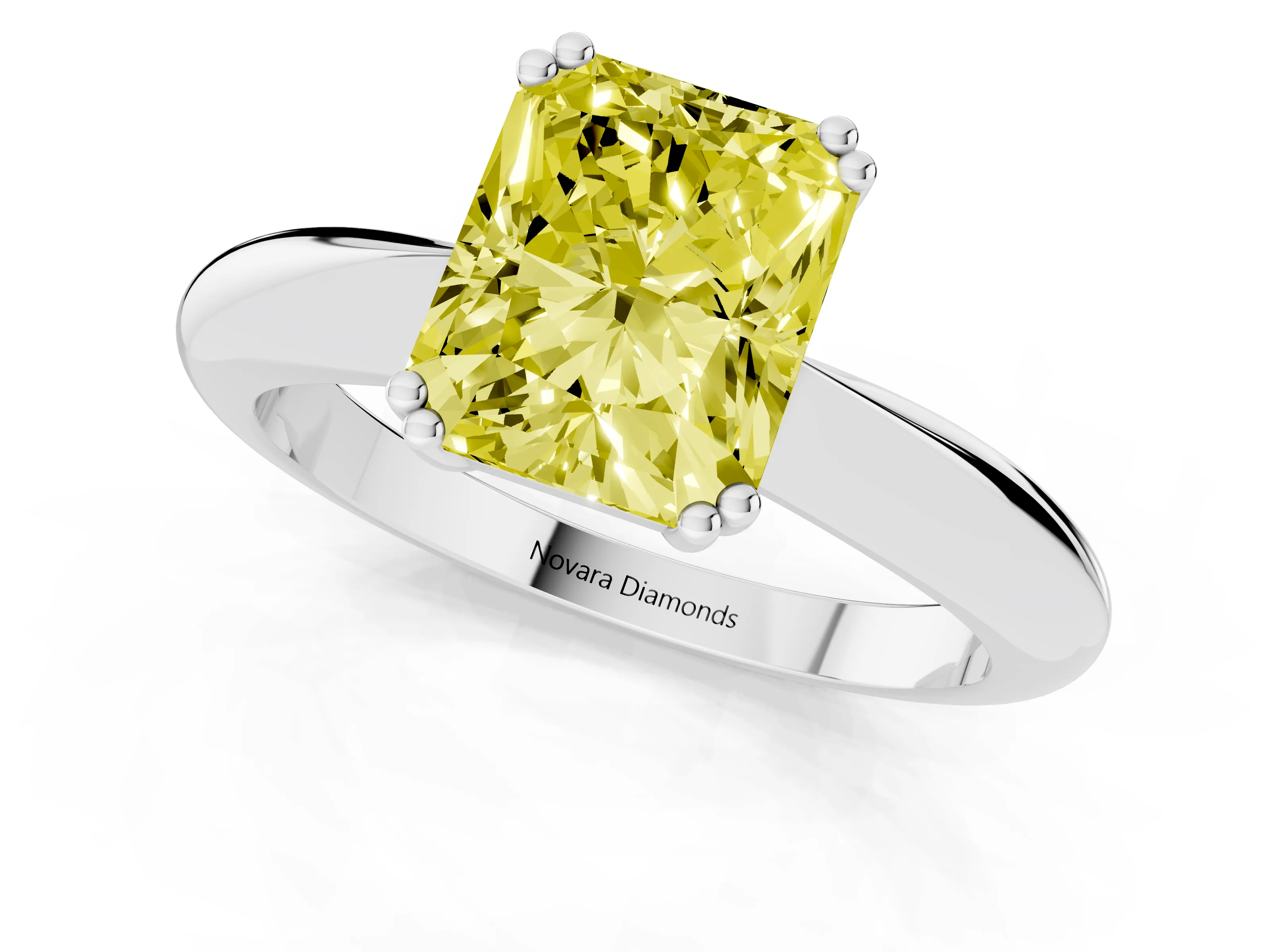 Fancy Yellow Radiant Cut Diamond Solitaire Engagement Ring Set in White gold with Tapered Band and Prong Setting