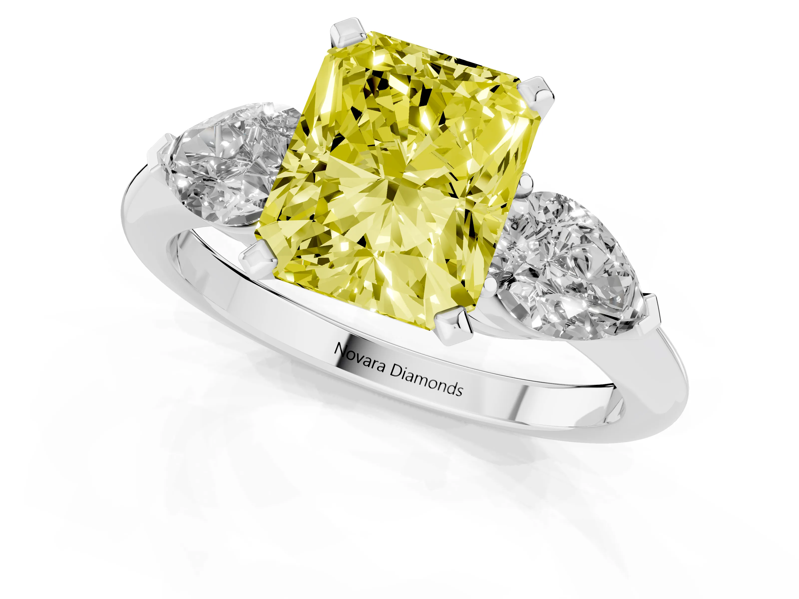 Fancy Yellow Three-Stone Radiant Cut Diamond Ring Set in Platinum with Pear Side Stones and Prong Setting