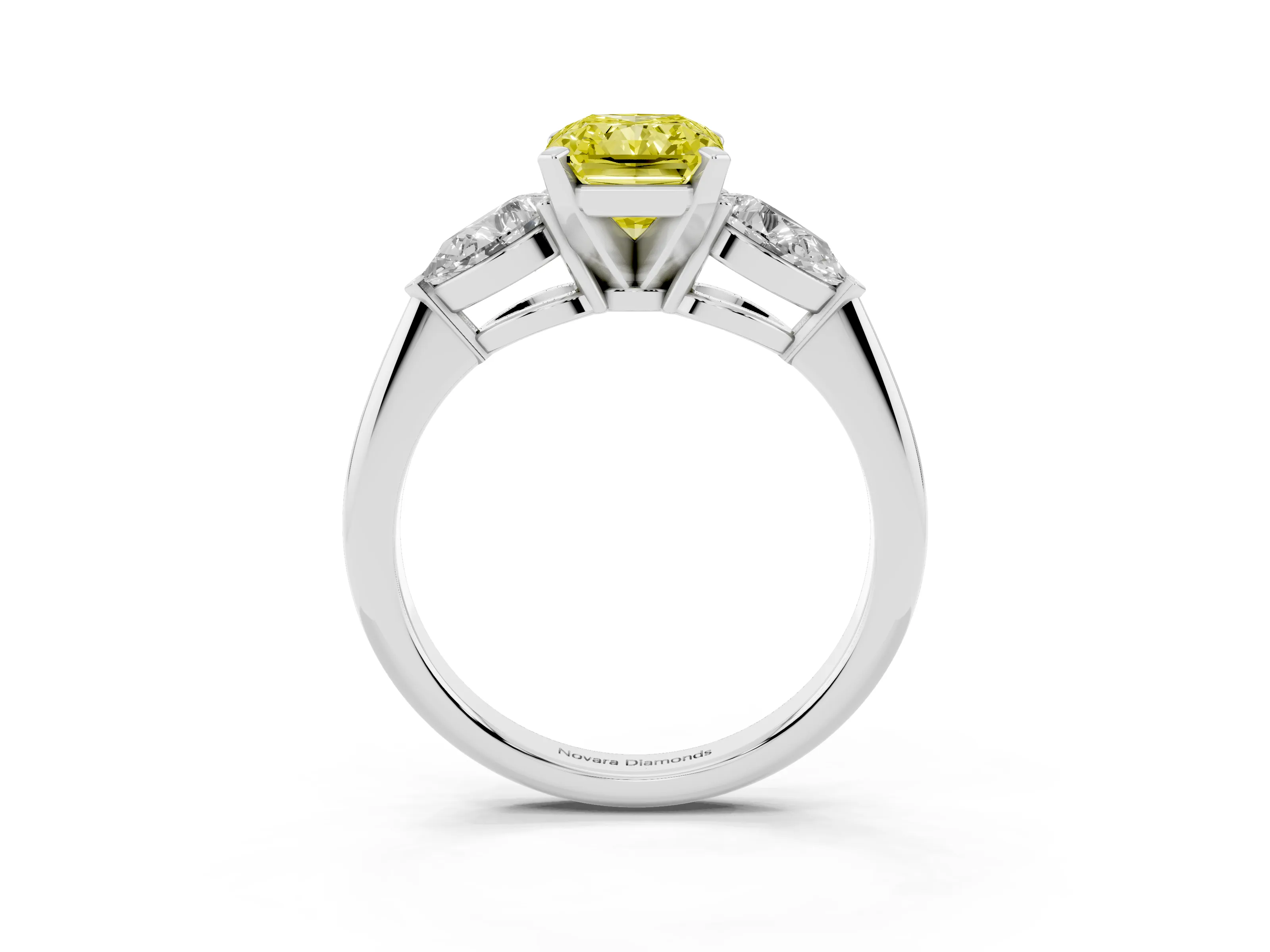 Fancy Yellow Three-Stone Radiant Cut Diamond Ring Set in Platinum with Pear Side Stones and Prong Setting