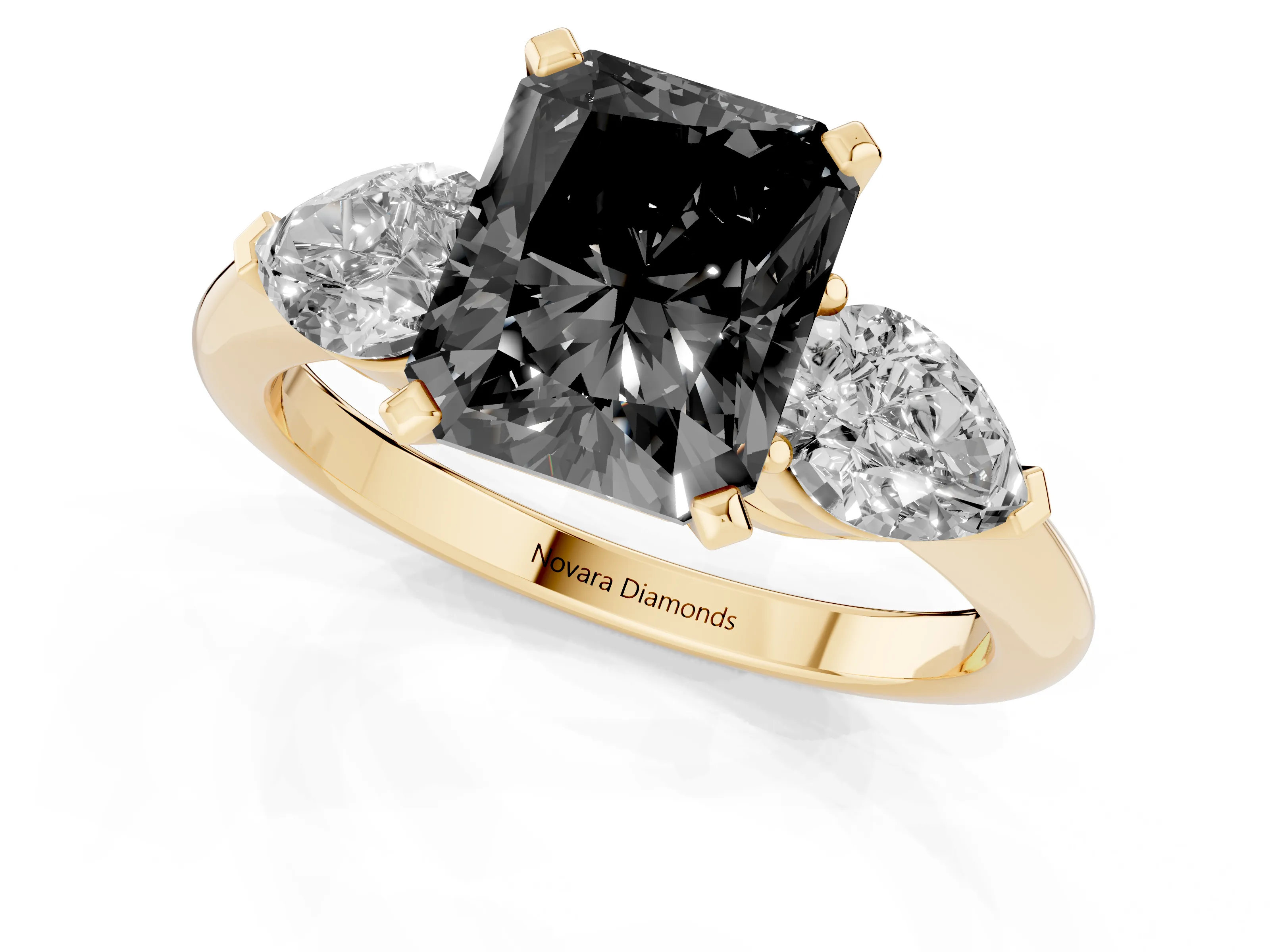 Fancy Black Three-Stone Radiant Cut Diamond Ring Set in Yellow gold with Pear Side Stones and Prong Setting