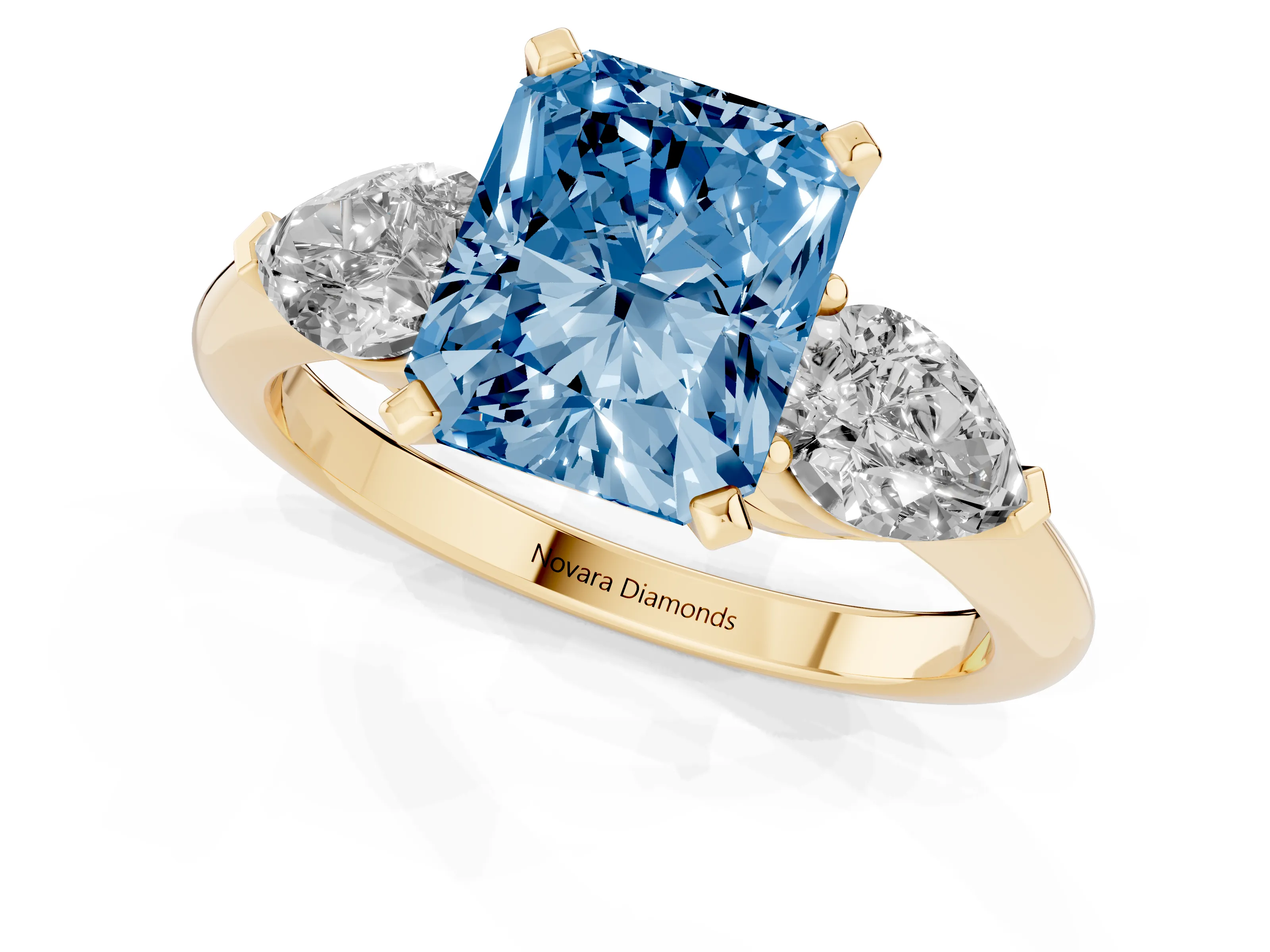 Fancy Blue Three-Stone Radiant Cut Diamond Ring Set in Yellow gold with Pear Side Stones and Prong Setting