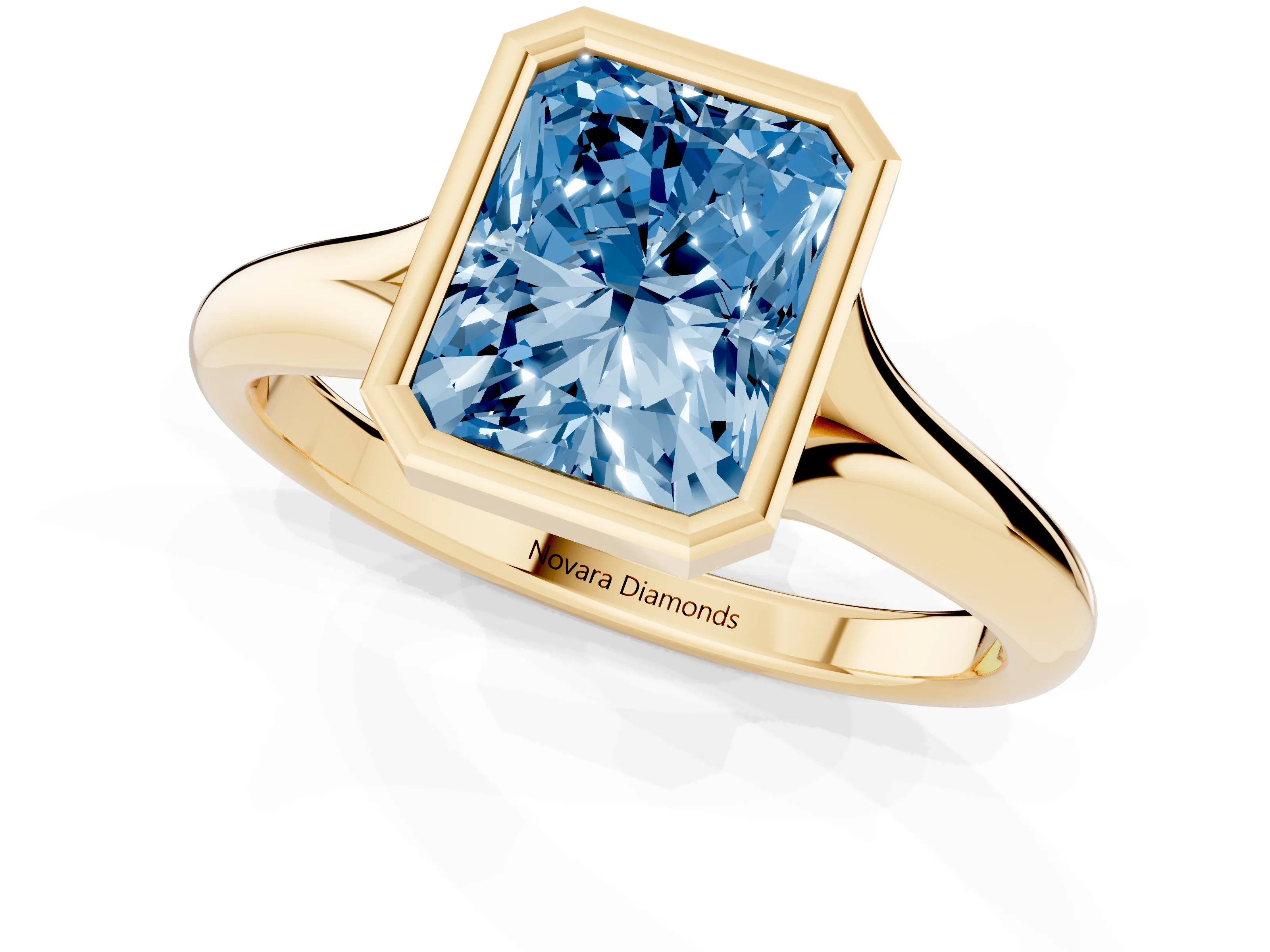 Fancy Blue Bezel Set Radiant Cut Diamond Solitaire Ring Set in Yellow gold with Smooth Band