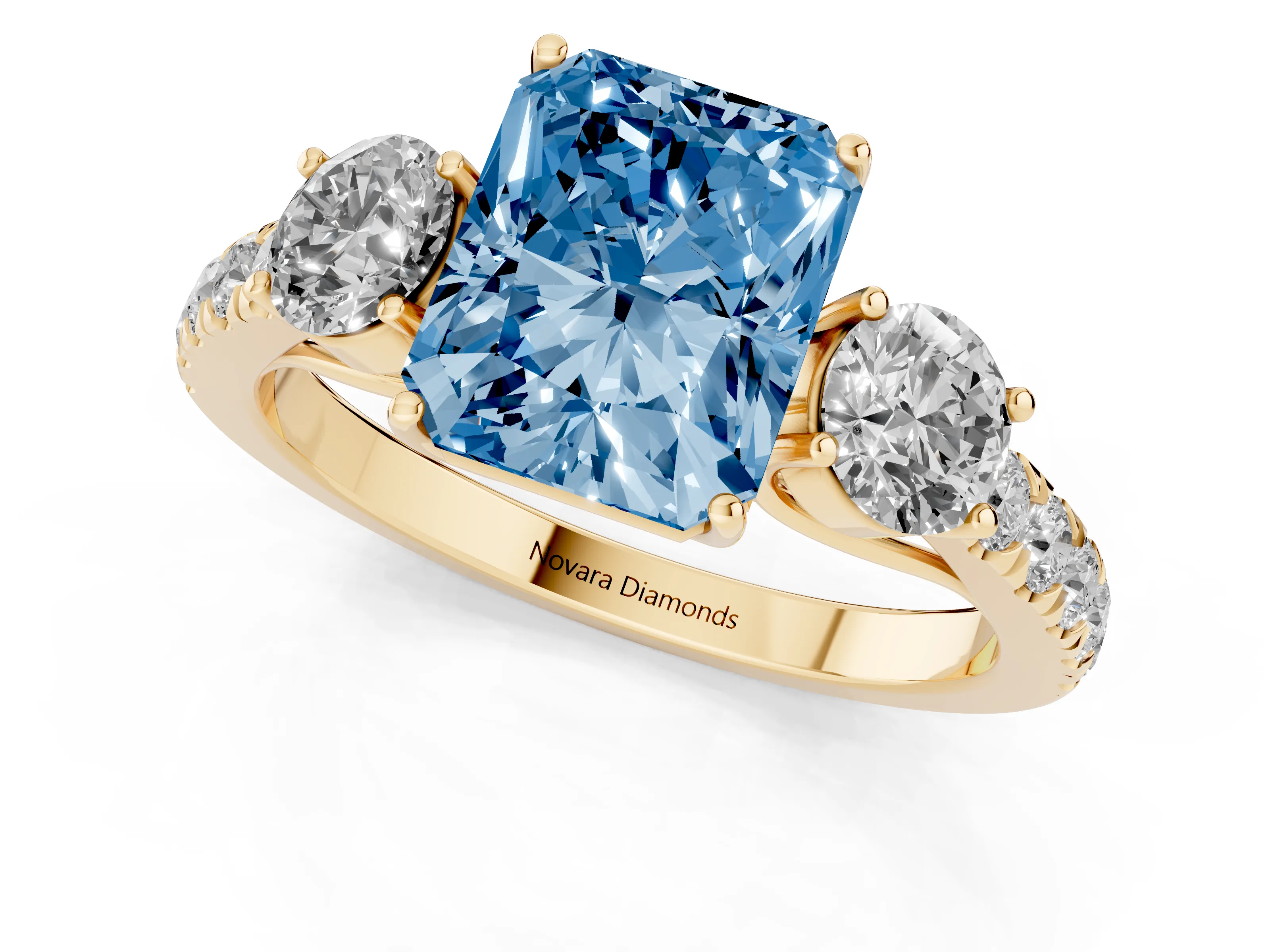 Fancy Blue Radiant Cut Diamond Three-Stone Ring Set in Yellow gold with Round Side Stones and Delicate Pavé Band