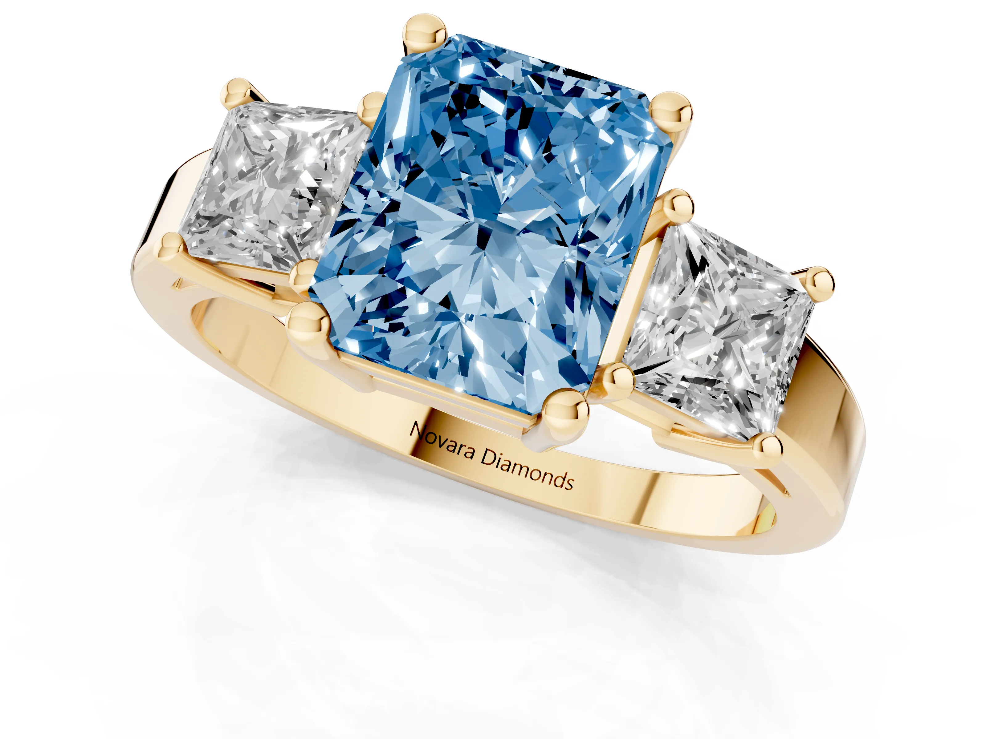 Fancy Blue Three-Stone Radiant Cut Diamond Solitaire Ring Set in Yellow gold with Prong Setting
