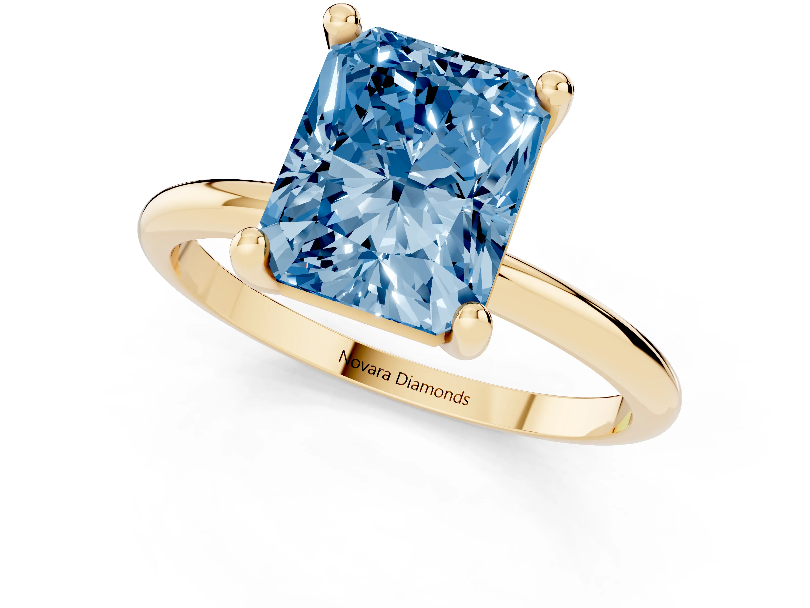 Fancy Blue Radiant Cut Diamond Solitaire Ring Set in Yellow gold with Secure Prong Setting on a Classic Band