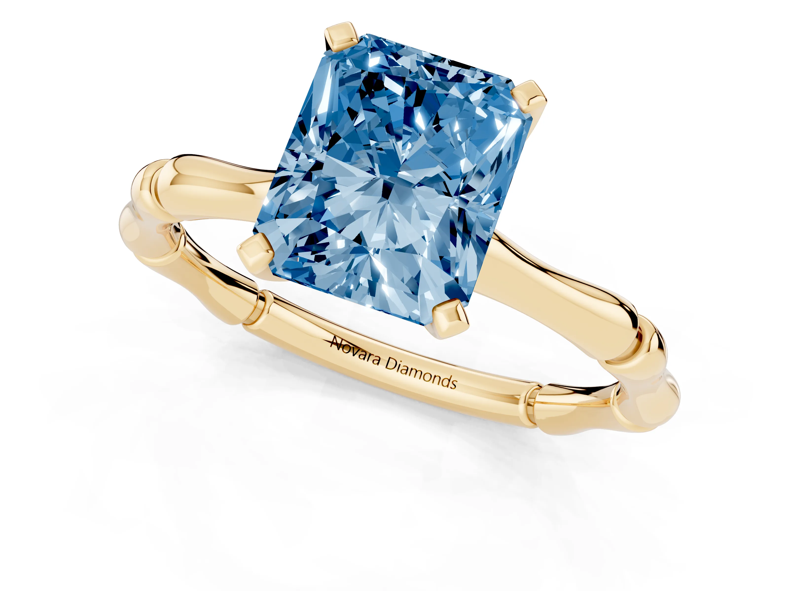 Fancy Blue Radiant Cut Diamond Solitaire Ring Set in Yellow gold with Bamboo Band and Prong Setting