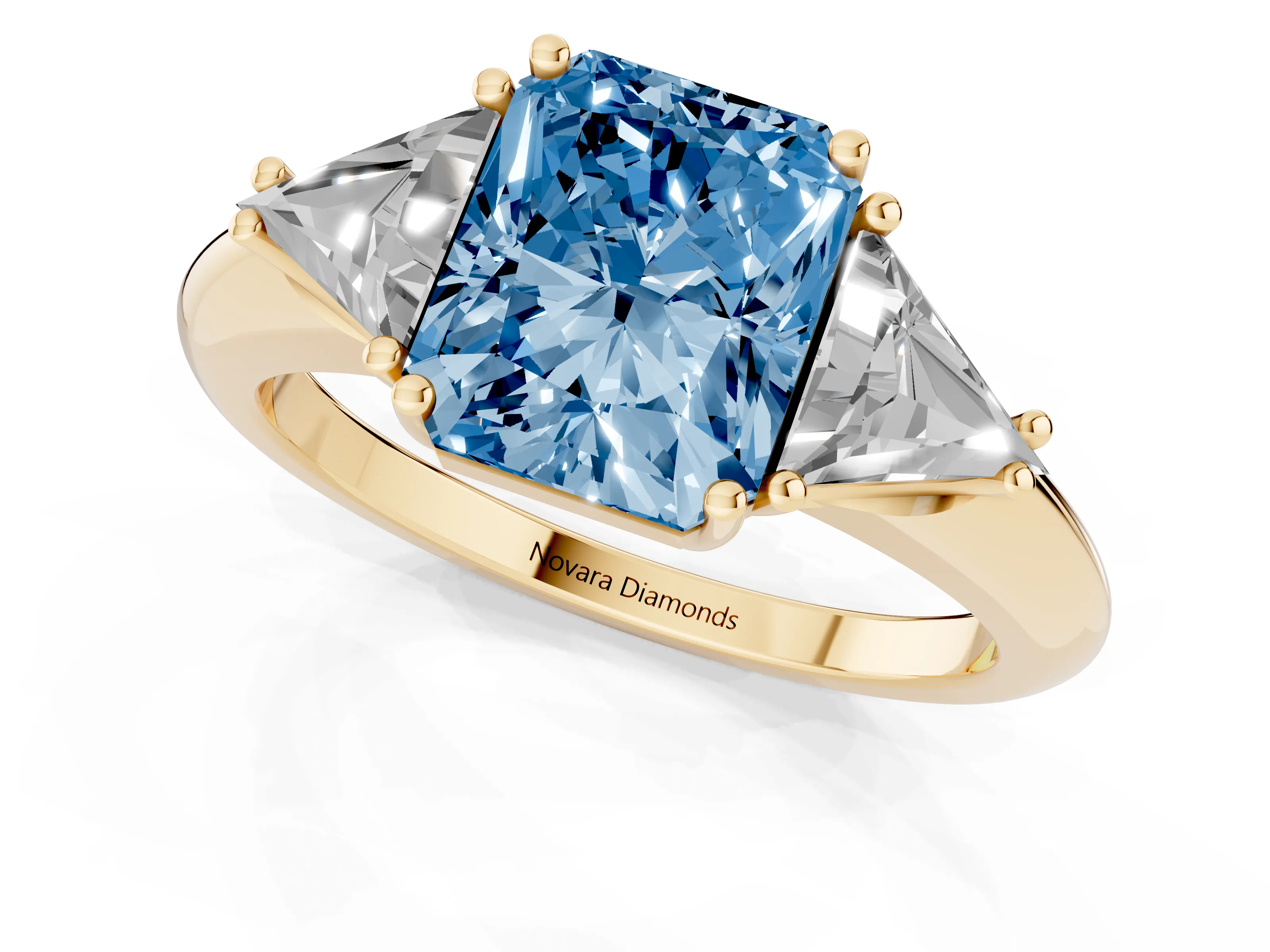 Fancy Blue Radiant Cut Diamond Three-Stone Engagement Ring Set in Yellow gold with Trillion Side Stones