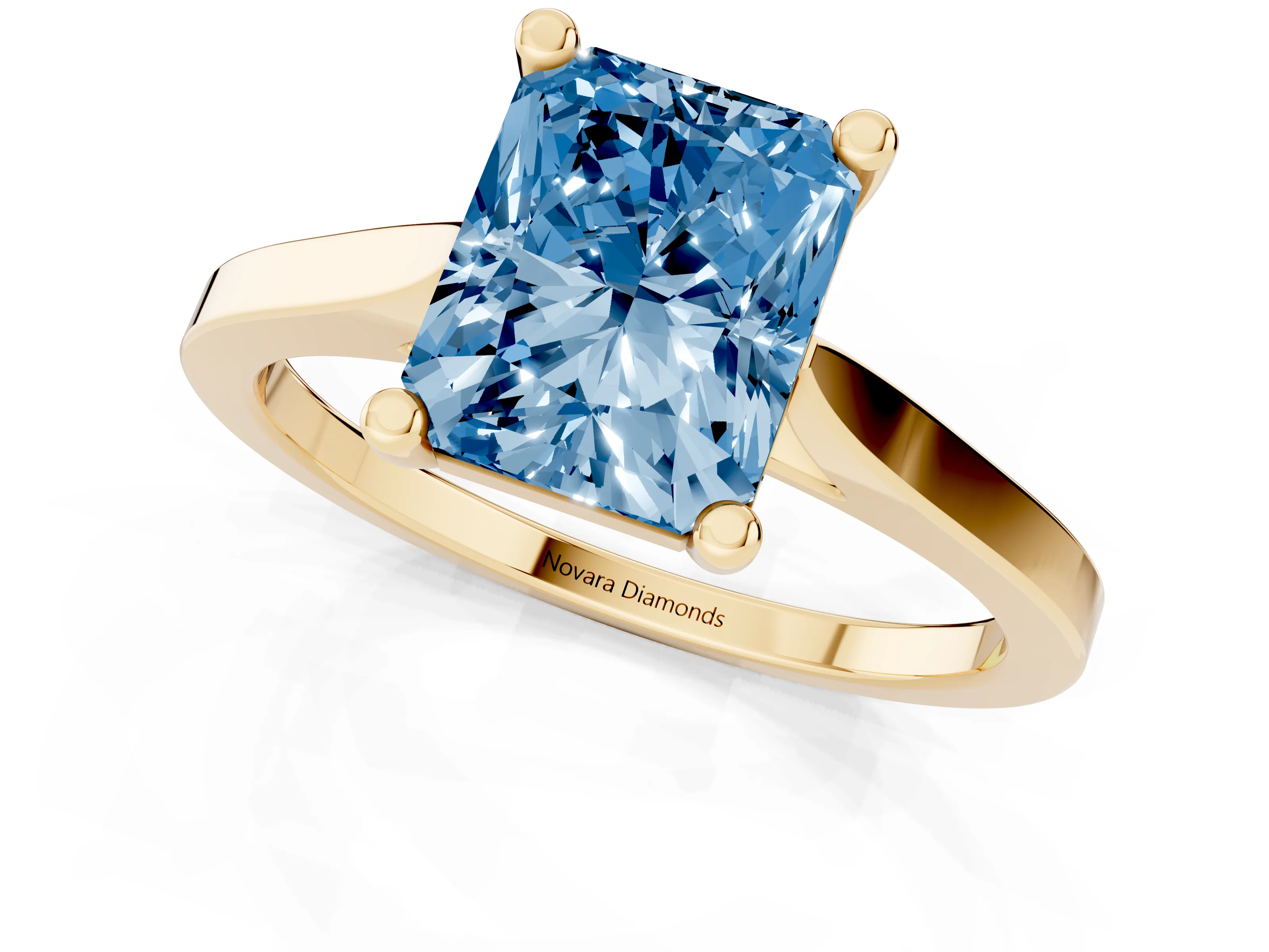 Fancy Blue Radiant Cut Diamond Solitaire Ring Set in Yellow gold with Prong Setting and Tapered Band