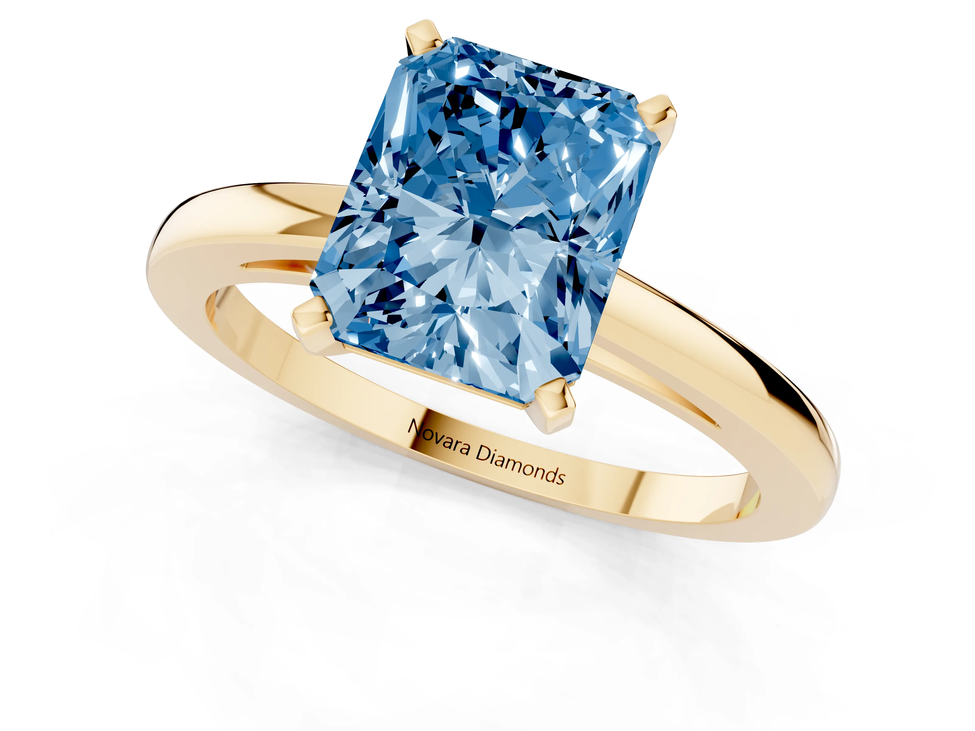 Fancy Blue Radiant Cut Diamond Solitaire Engagement Ring Set in Yellow gold with Prong Setting on a Classic Band