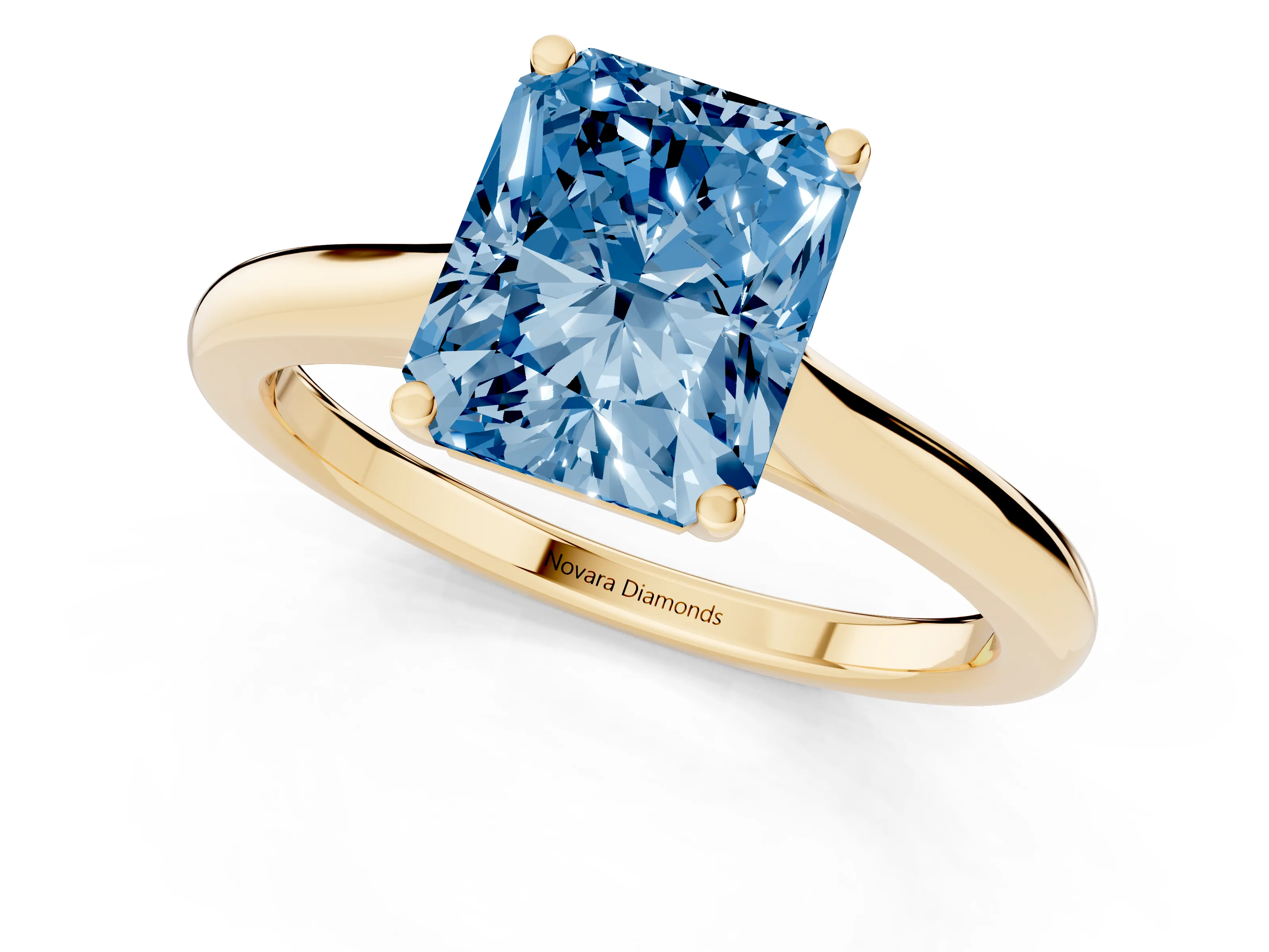 Fancy Blue Radiant Cut Diamond Solitaire Ring Set in Yellow gold with Cathedral Band and Prong Setting