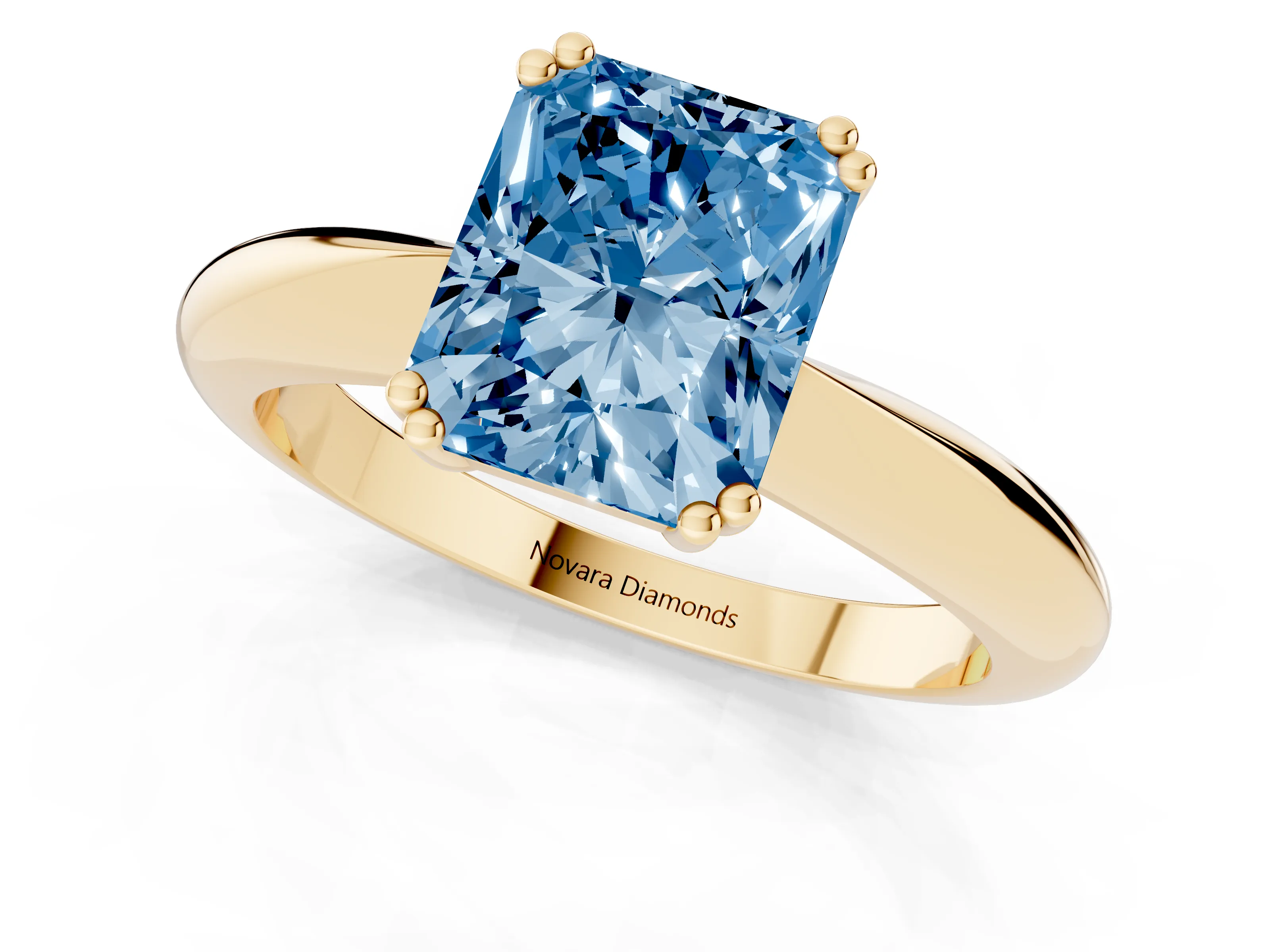 Fancy Blue Radiant Cut Diamond Solitaire Engagement Ring Set in Yellow gold with Tapered Band and Prong Setting