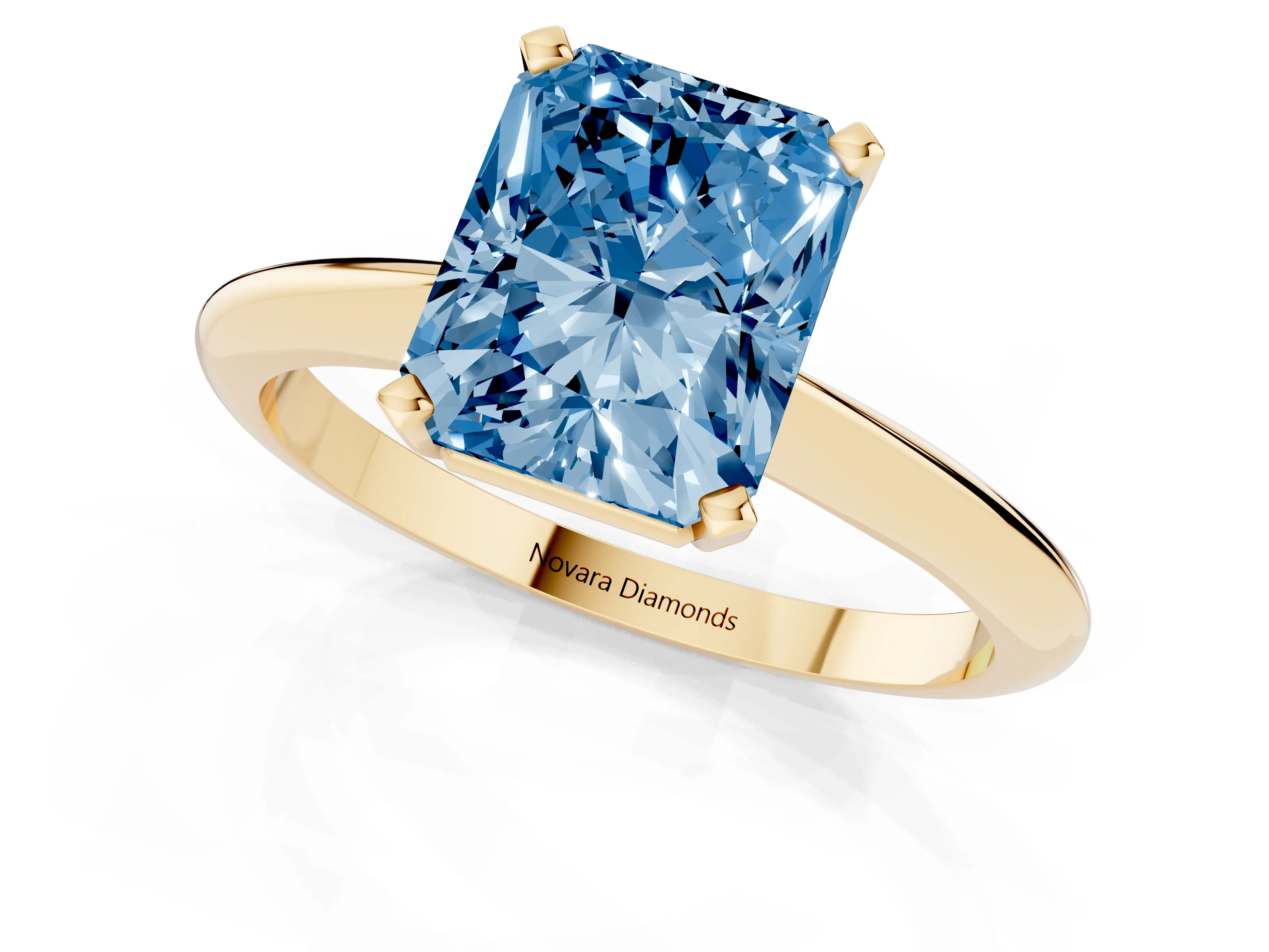 Fancy Blue Radiant Cut Diamond Solitaire Ring Set in Yellow gold with Prong Setting on a Plain Round Band