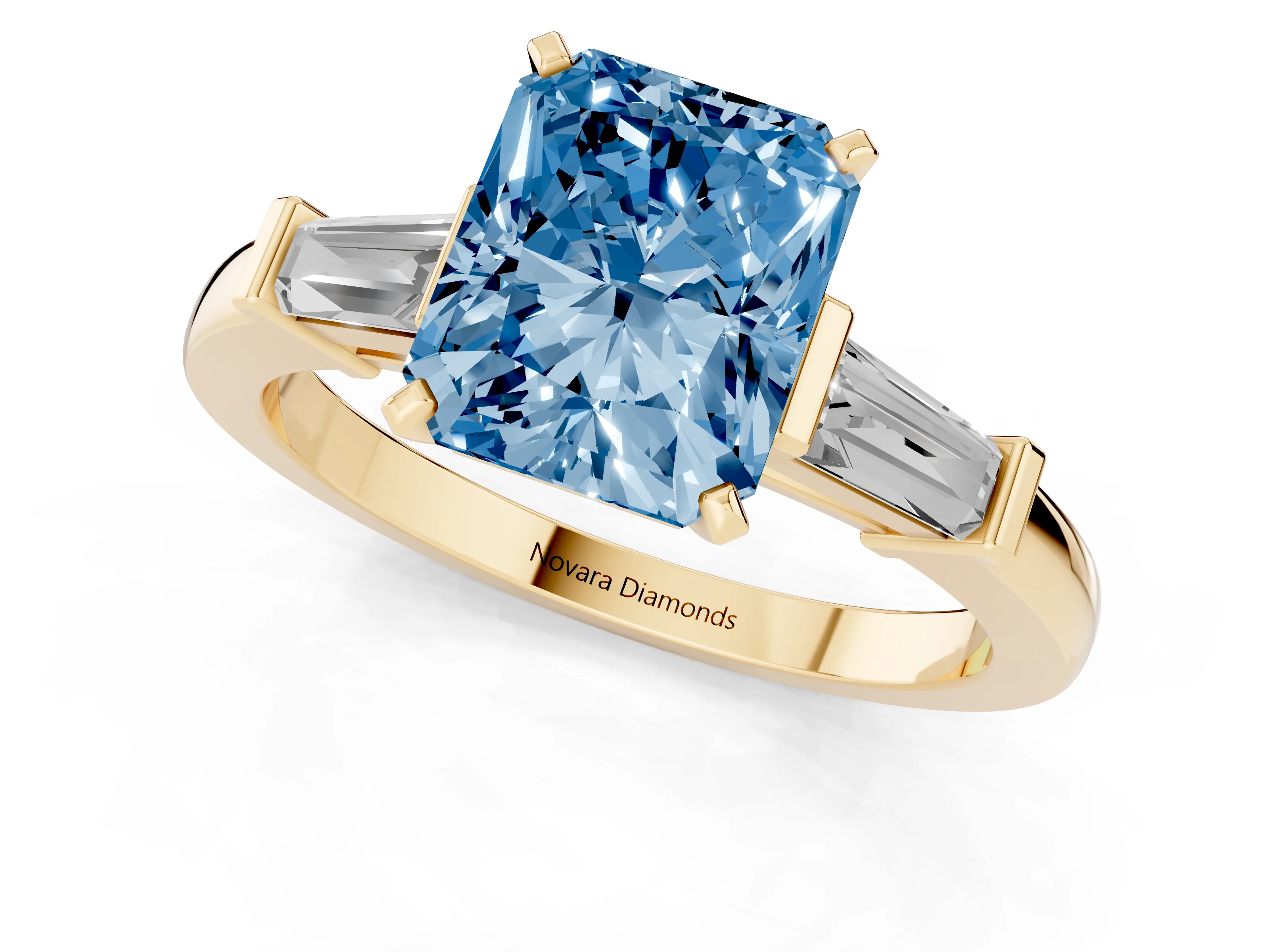 Fancy Blue Radiant Cut Diamond Solitaire Ring Set in Yellow gold with Tapered Baguette Accents and Prong Setting