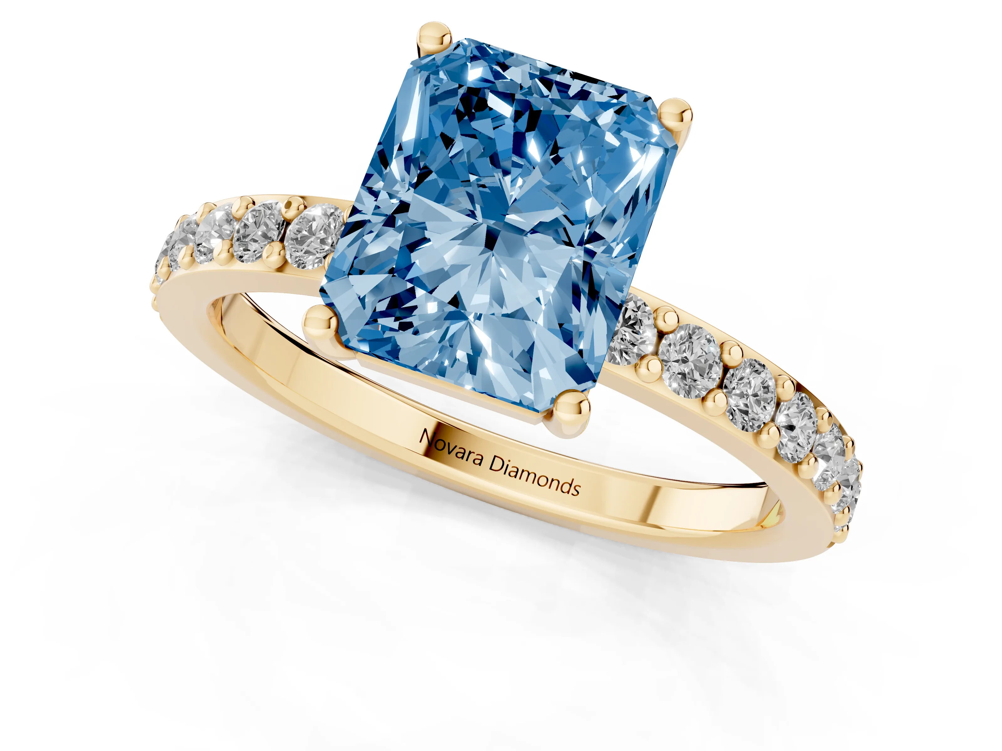 Fancy Blue Radiant Cut Diamond Solitaire Set in Yellow gold with Round Pavé Band and Prong Setting