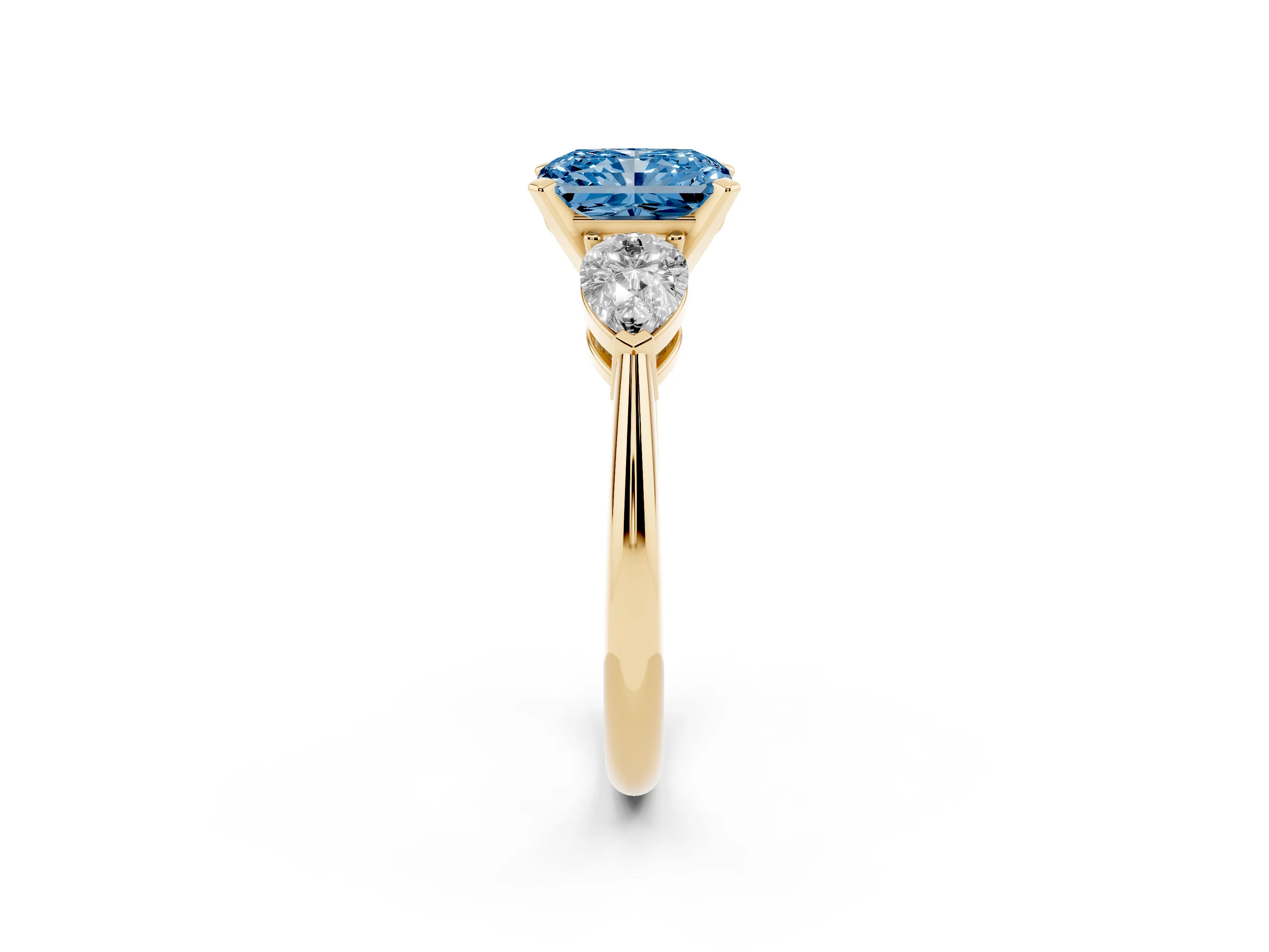 Fancy Blue Three-Stone Radiant Cut Diamond Ring Set in Yellow gold with Pear Side Stones and Prong Setting