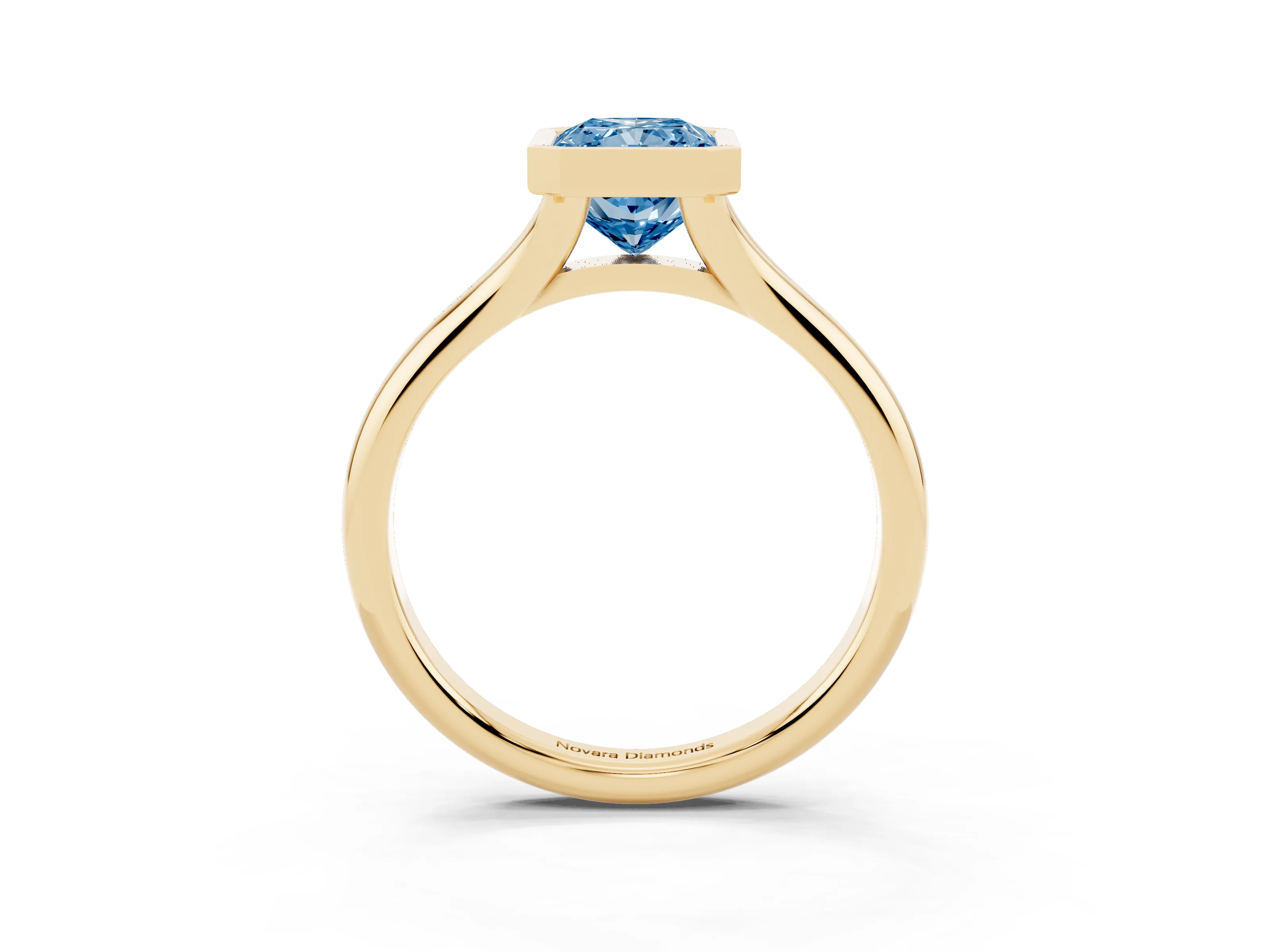 Fancy Blue Bezel Set Radiant Cut Diamond Solitaire Ring Set in Yellow gold with Smooth Band