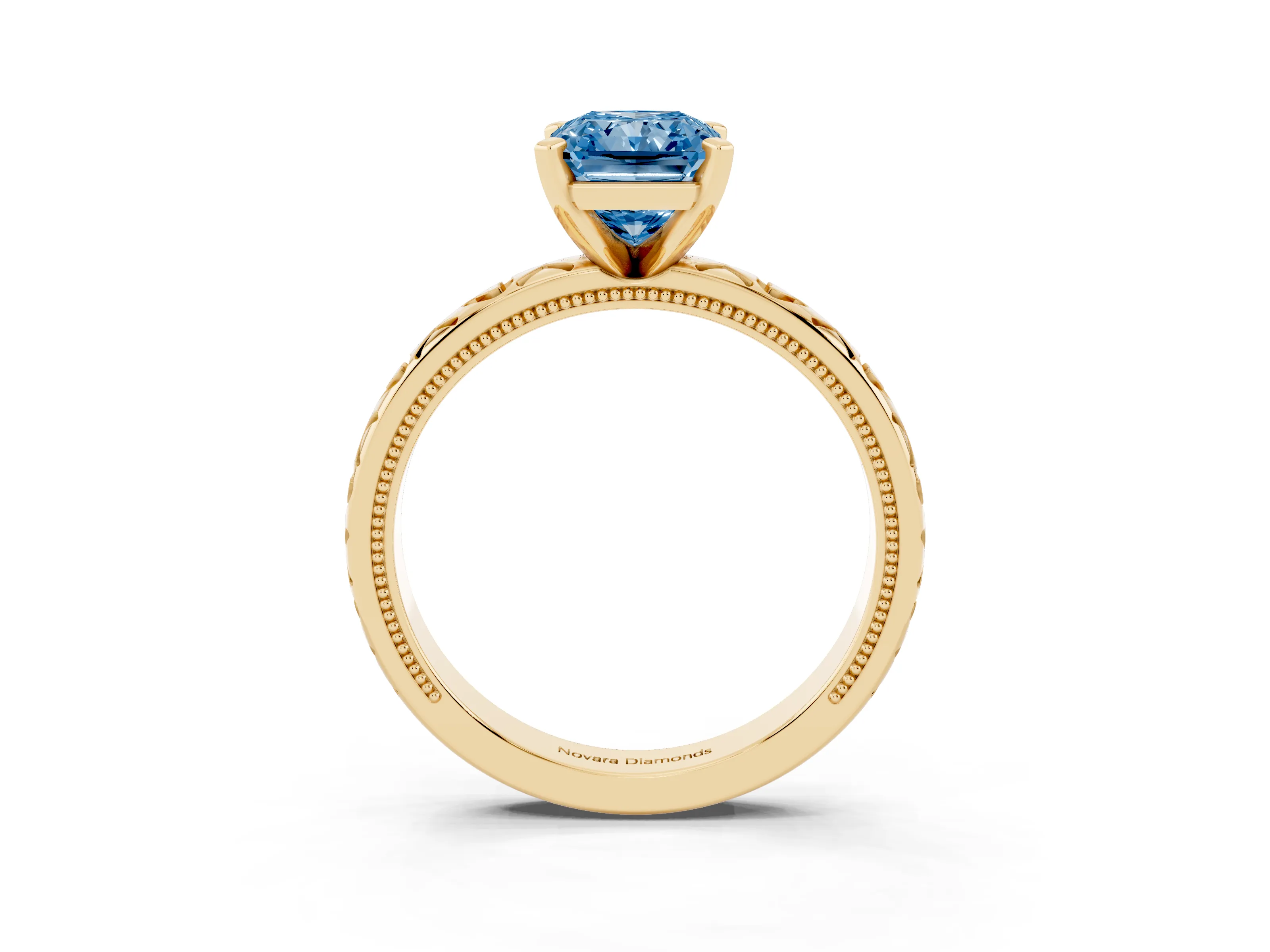 Fancy Blue Radiant Cut Diamond Solitaire Engagement Ring Set in Yellow gold with XO Engraved Band and Prong Setting