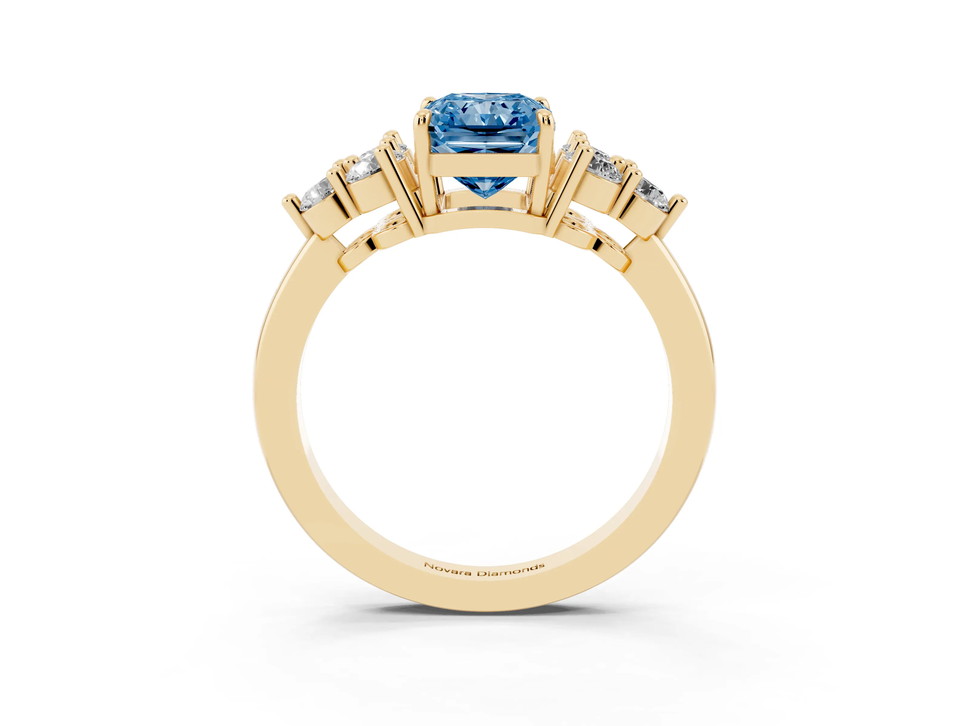 Fancy Blue Radiant Cut Diamond Solitaire Ring Set in Yellow gold with Cluster Accents on Each Side
