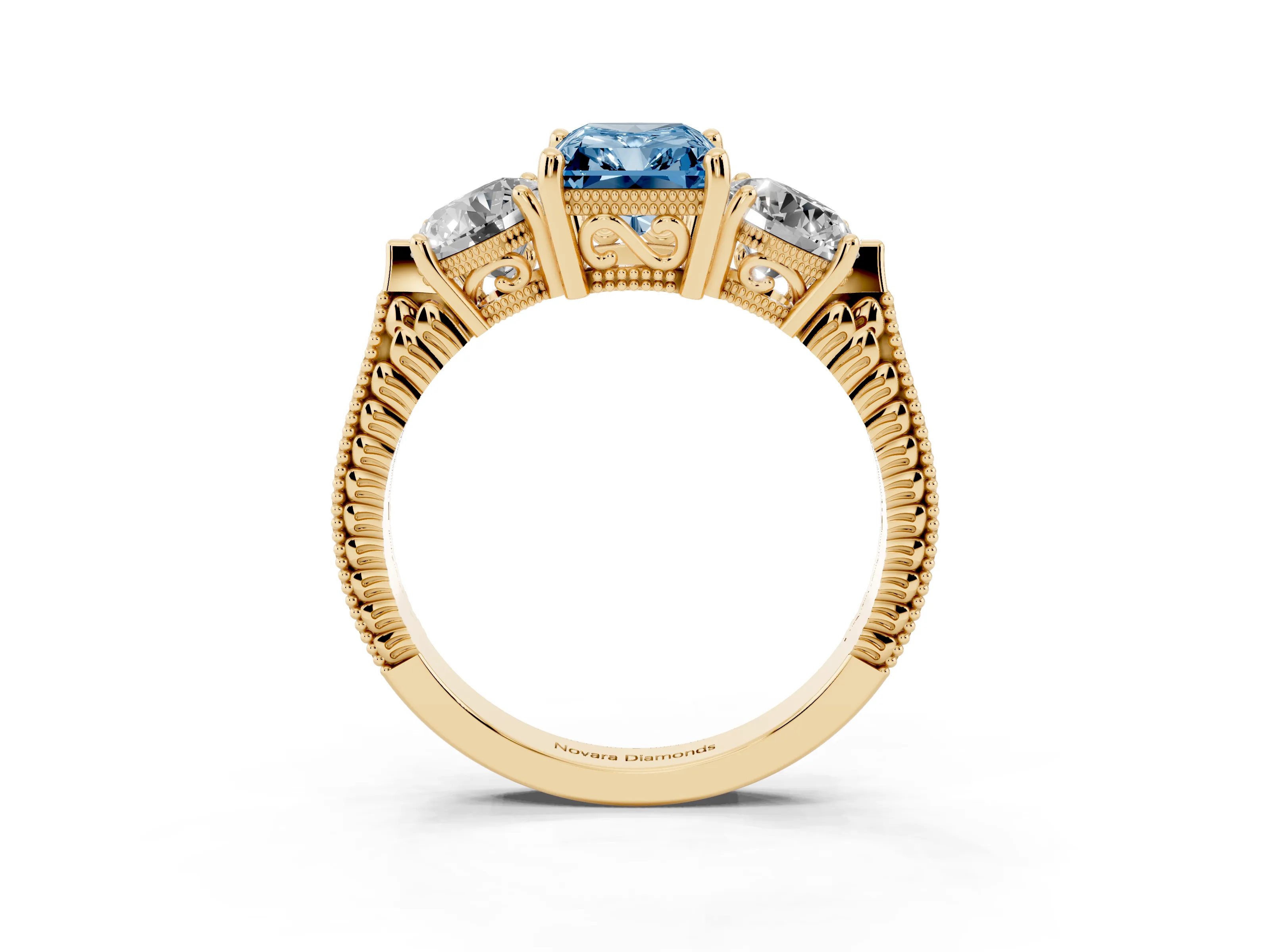 Fancy Blue Radiant Cut Diamond Three-Stone Ring Set in Yellow gold with Milgrain Band