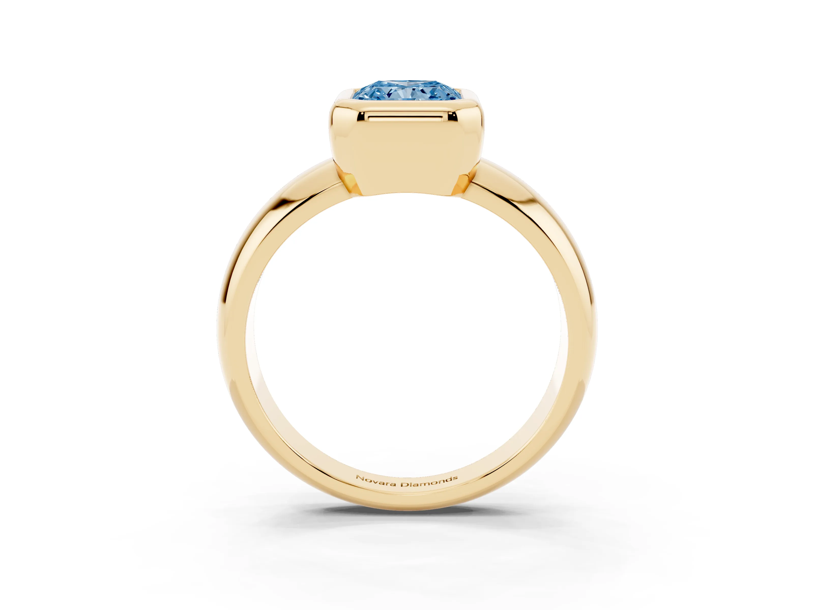 Fancy Blue Bezel Set Radiant Cut Diamond Solitaire Ring Set in Yellow gold with Wide Band