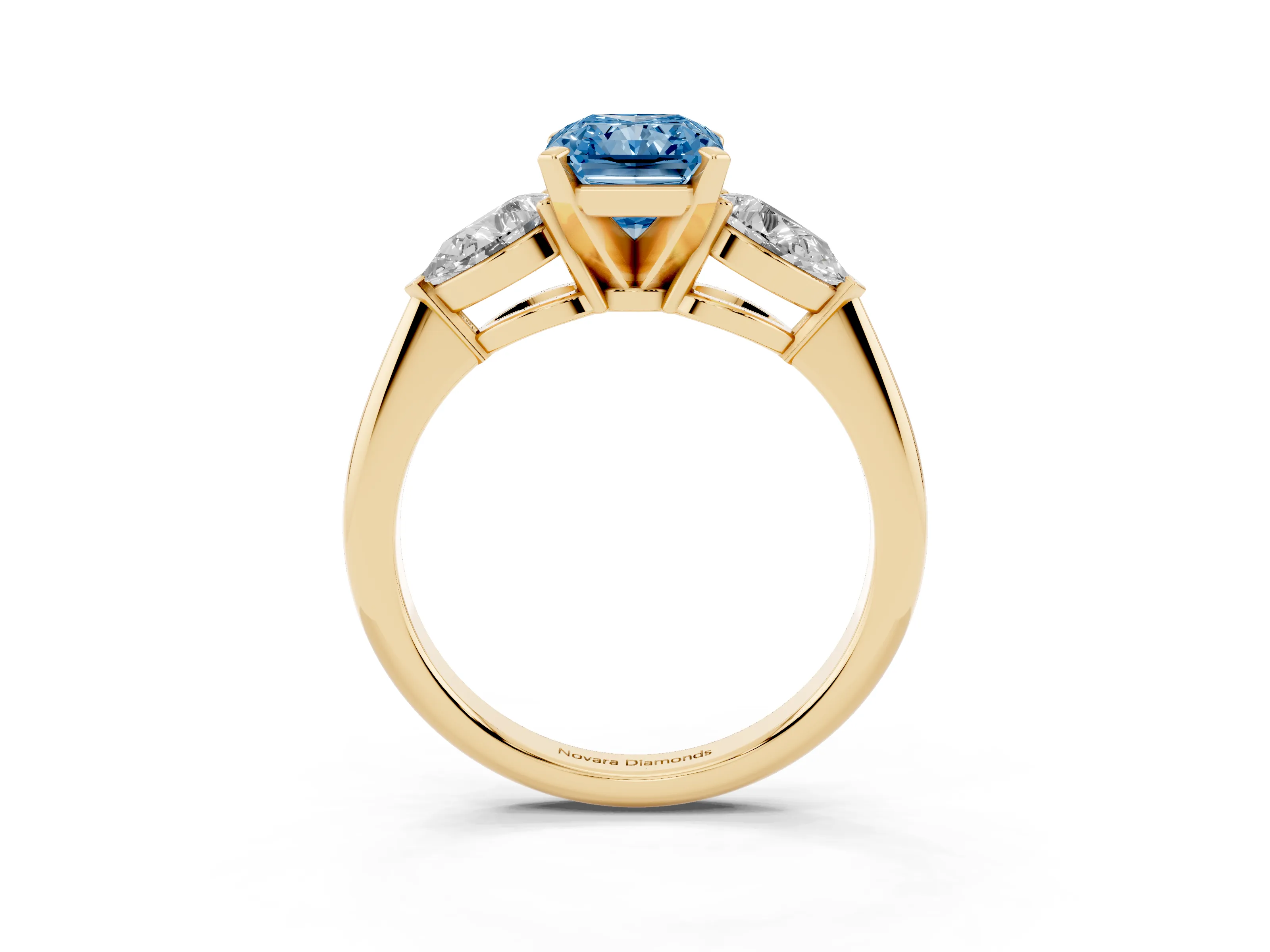 Fancy Blue Three-Stone Radiant Cut Diamond Ring Set in Yellow gold with Pear Side Stones and Prong Setting