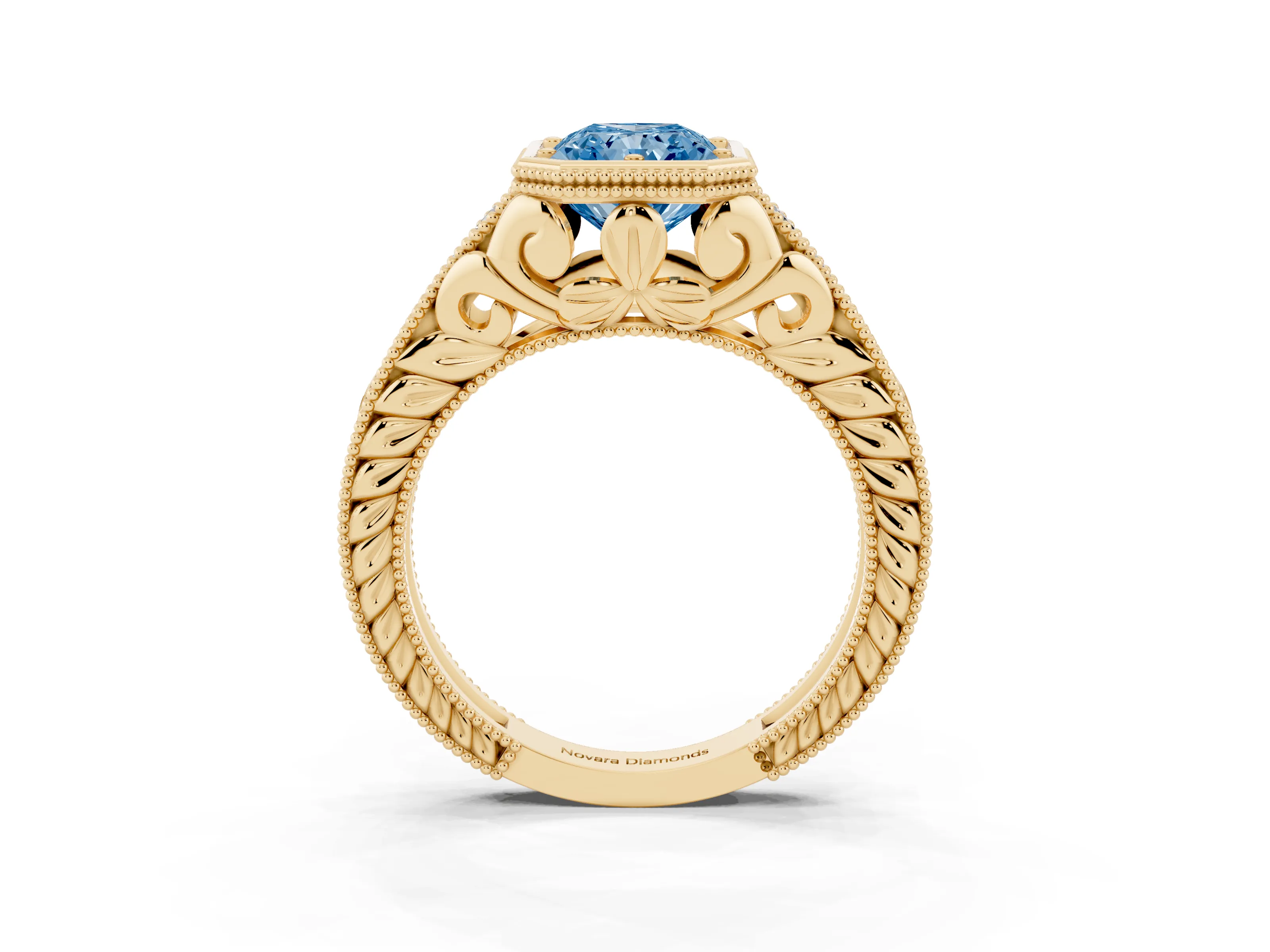 Fancy Blue Bezel Set Radiant Cut Diamond Milgrain Pavé Engagement Ring Set in Yellow gold