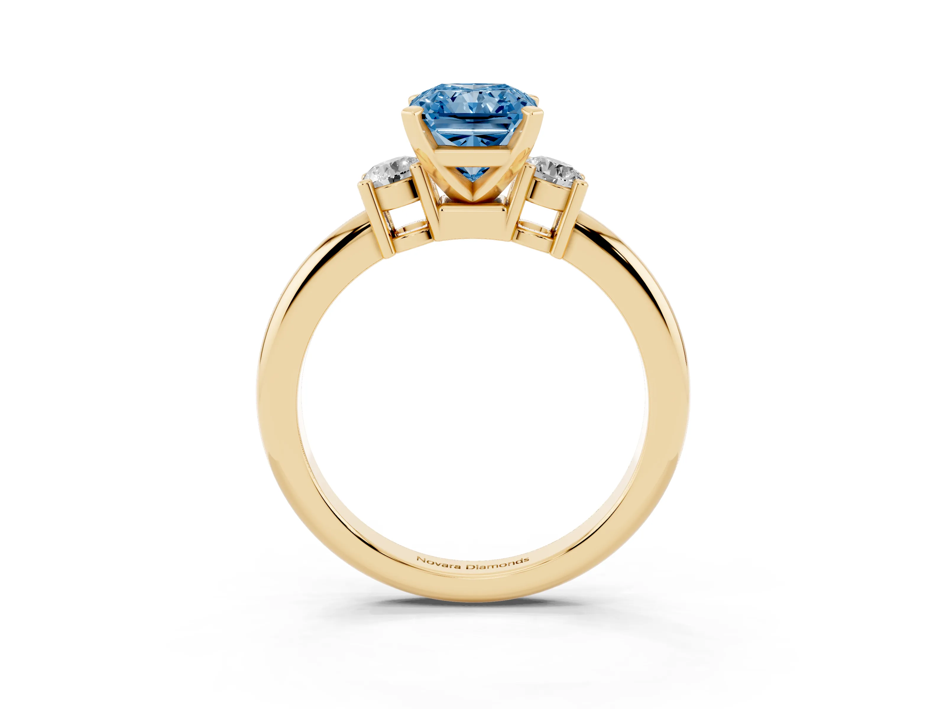 Fancy Blue Three-Stone Radiant Cut Diamond Ring Set in Yellow gold with Prong Setting and Plain Band