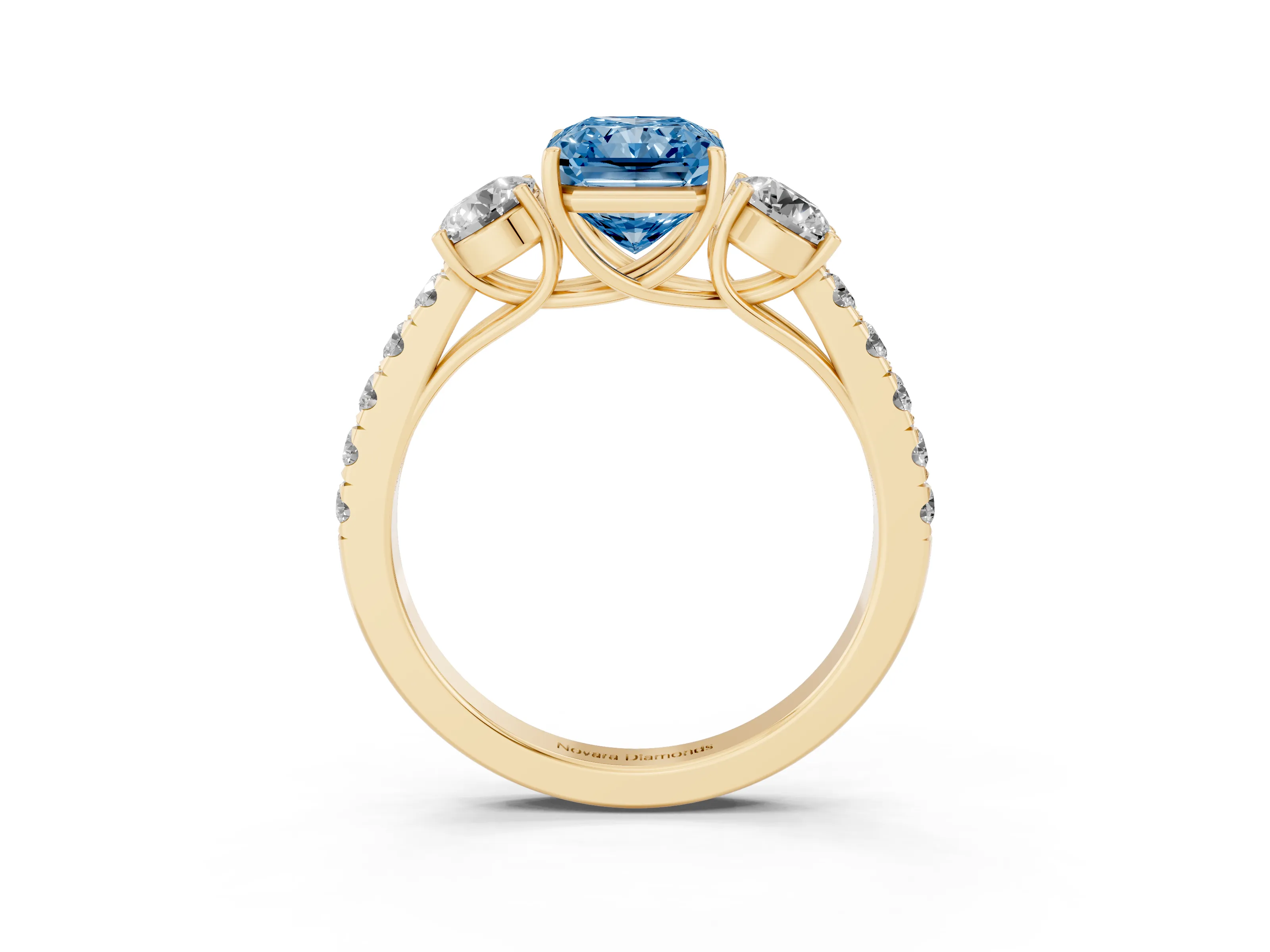 Fancy Blue Radiant Cut Diamond Three-Stone Ring Set in Yellow gold with Round Side Stones and Delicate Pavé Band